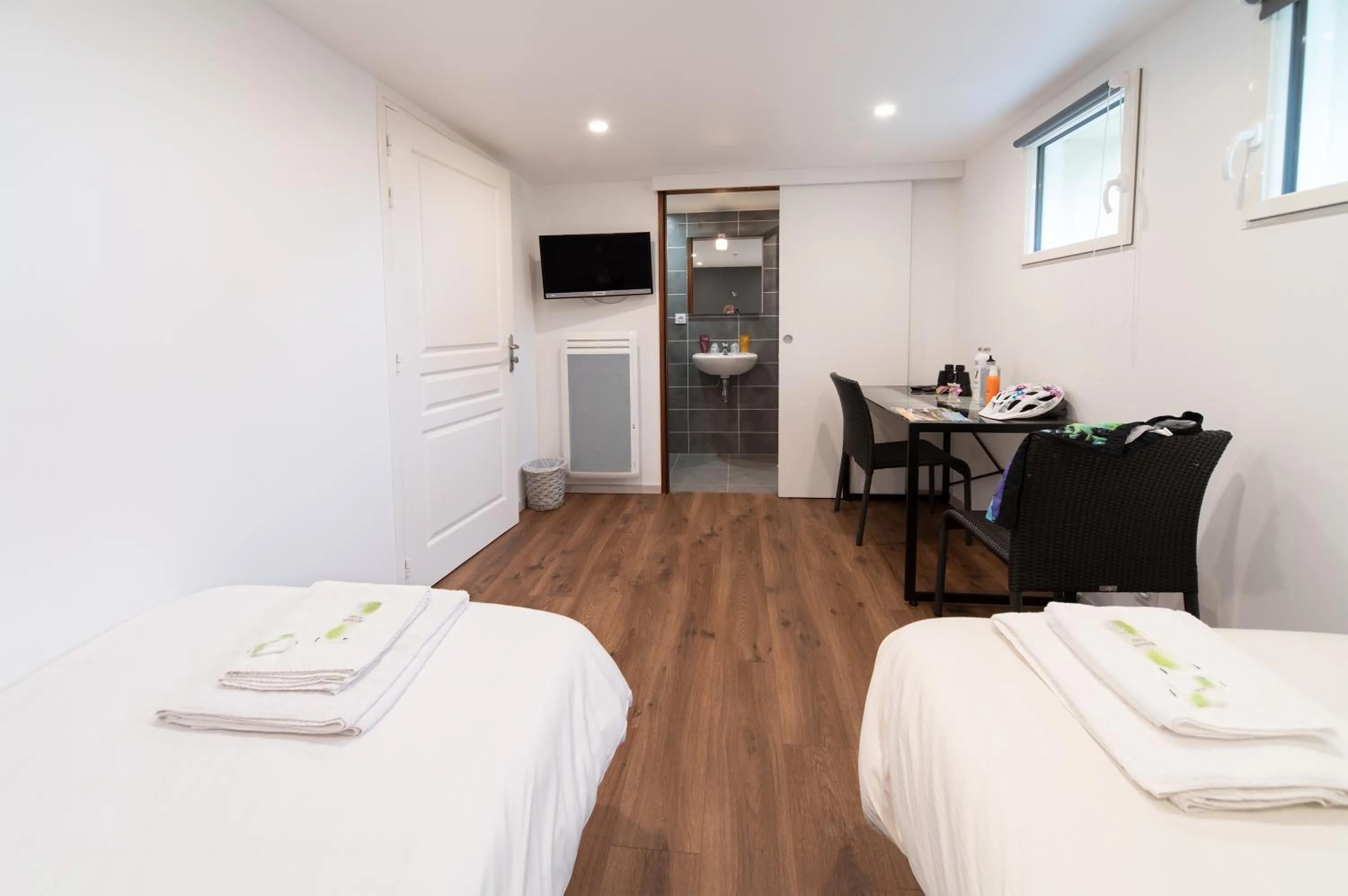 Bed in Logis Hôtel-restaurant Les Coudercous