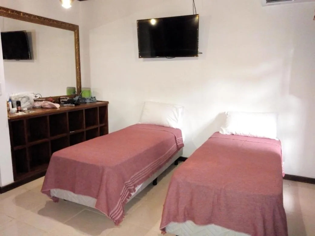 Bed in El Uru Suite Hotel