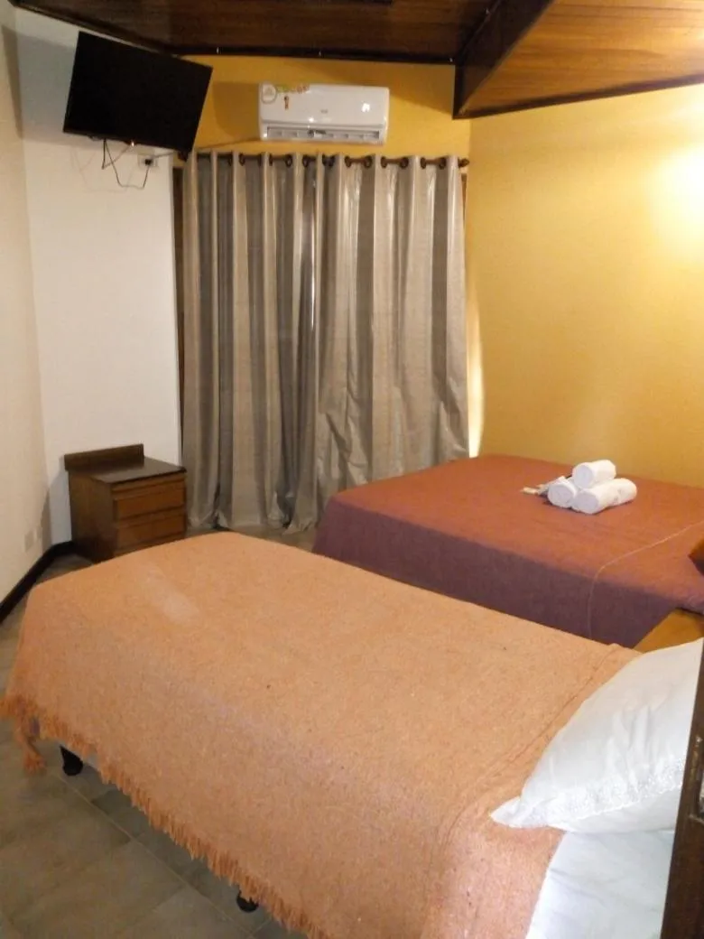 Bed in El Uru Suite Hotel