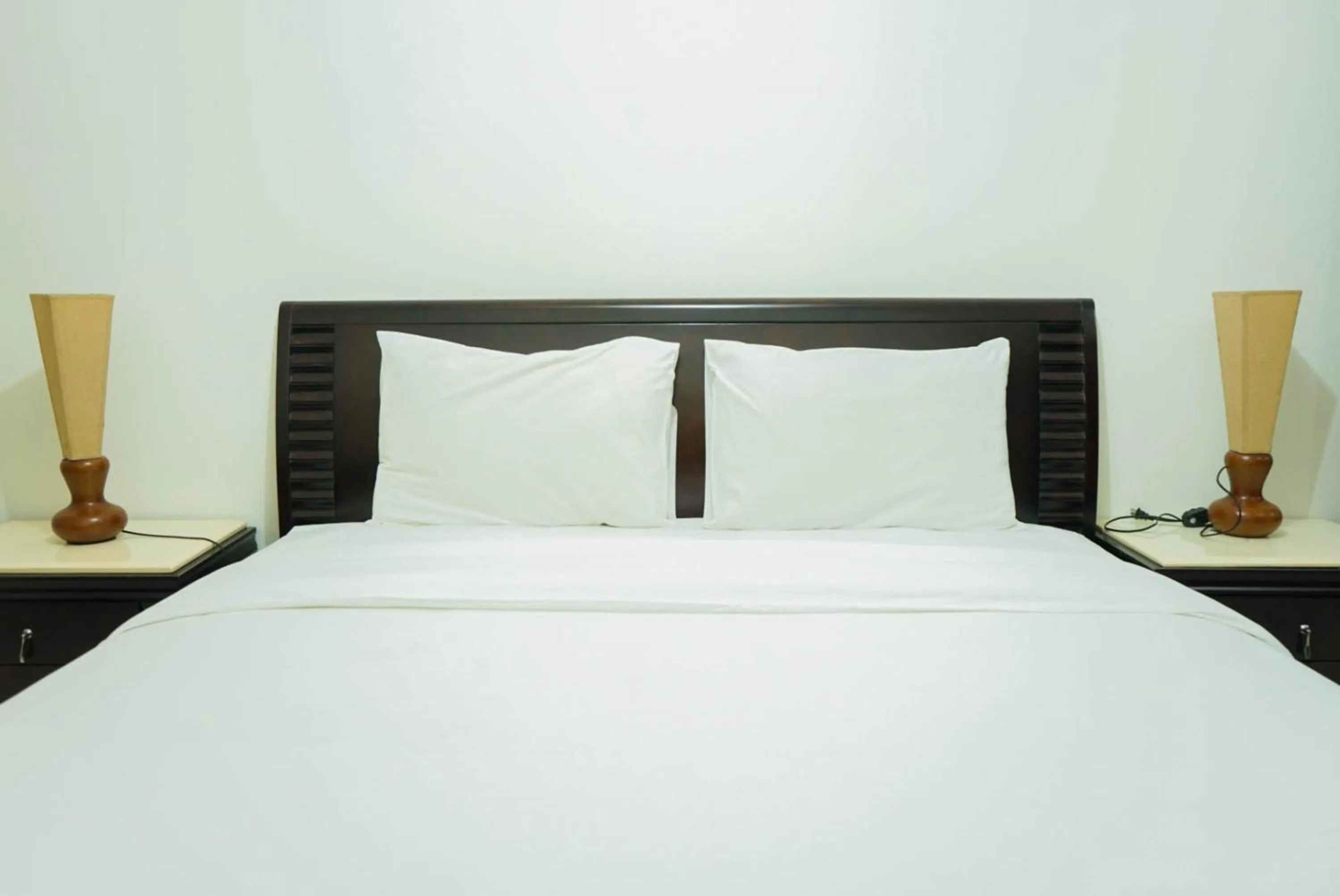 Bed in 2BR with Study Room at L'Avenue Apartment By Travelio