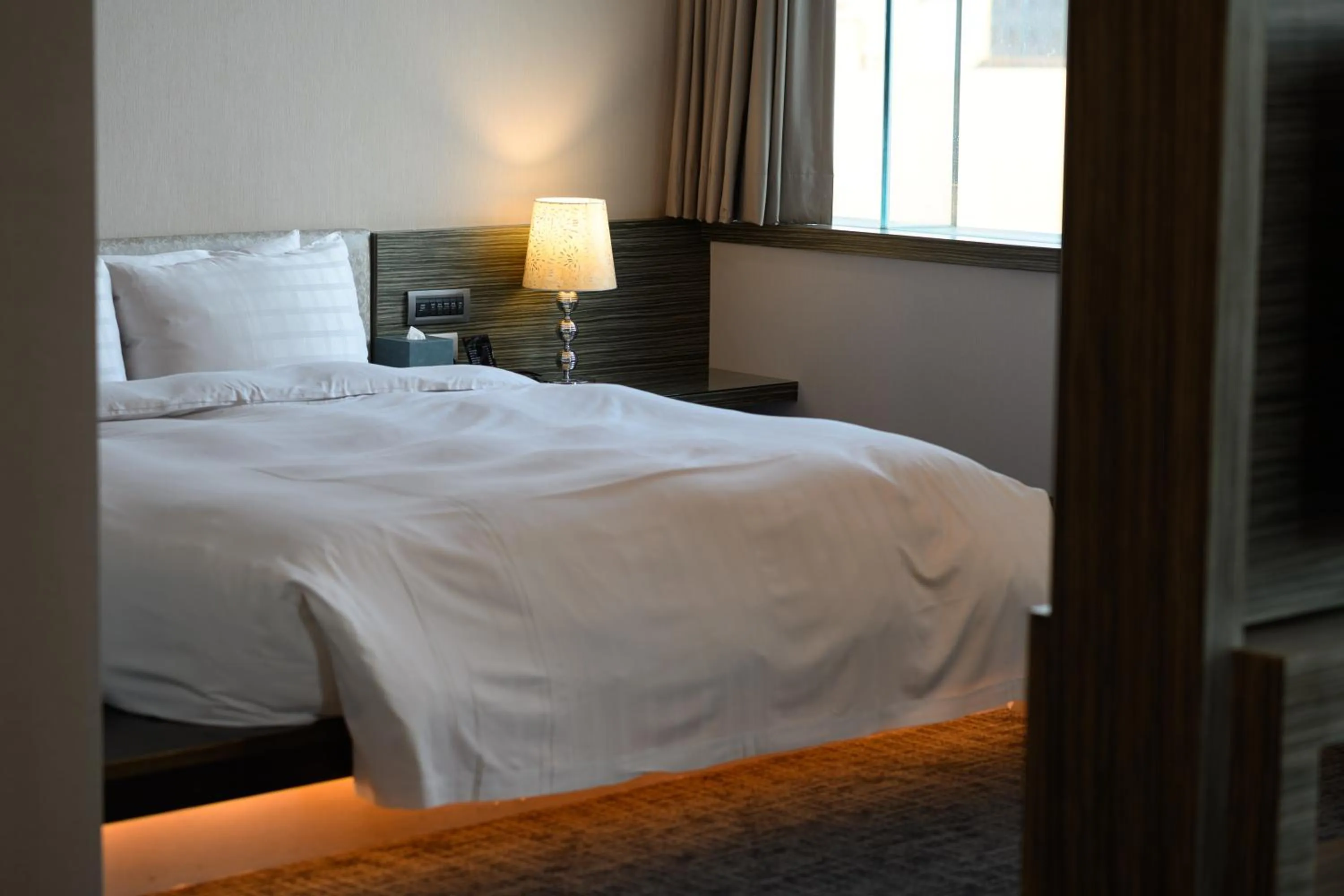 Bed in Hotel Geight Taipei