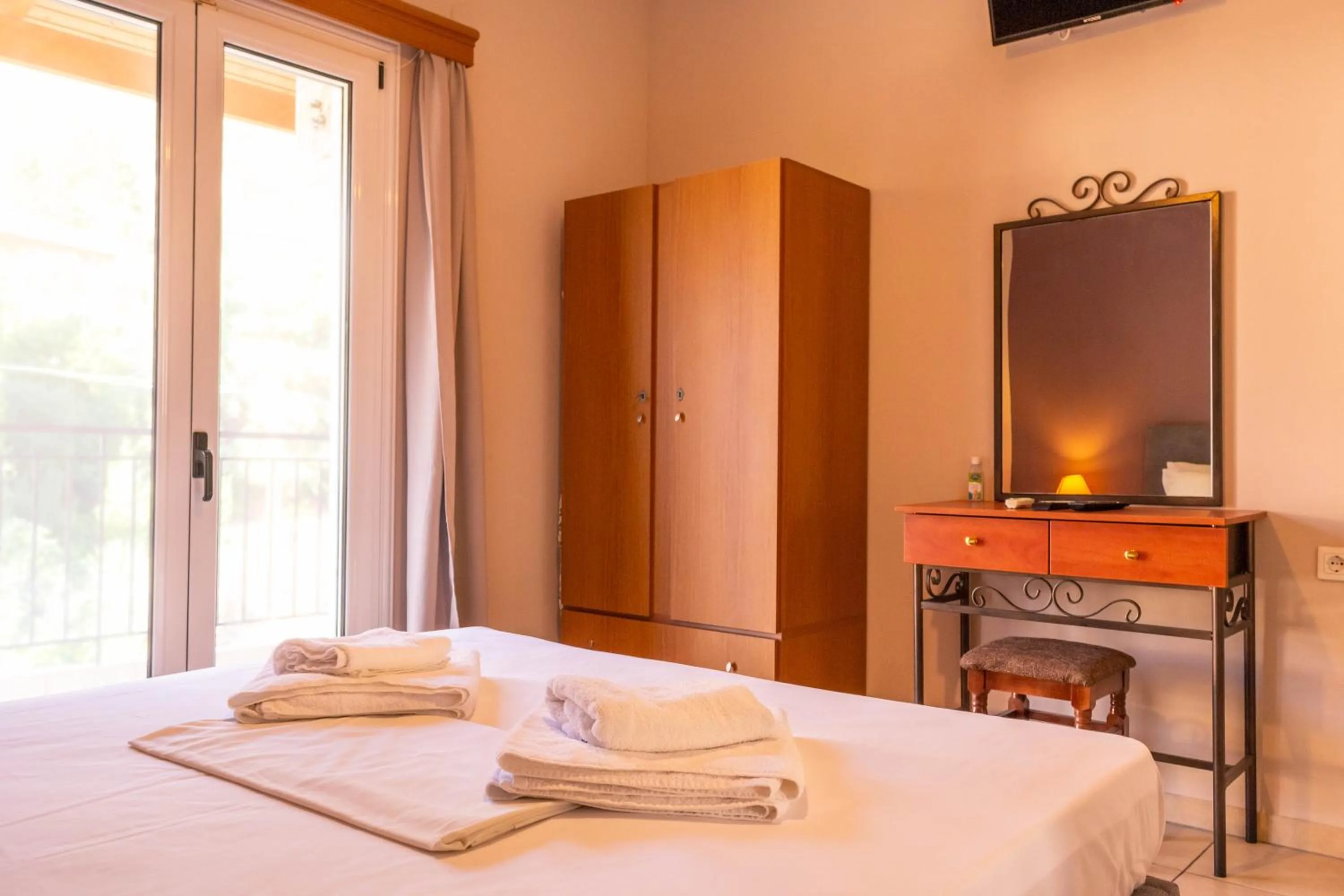 Bed in Apagio Apartments