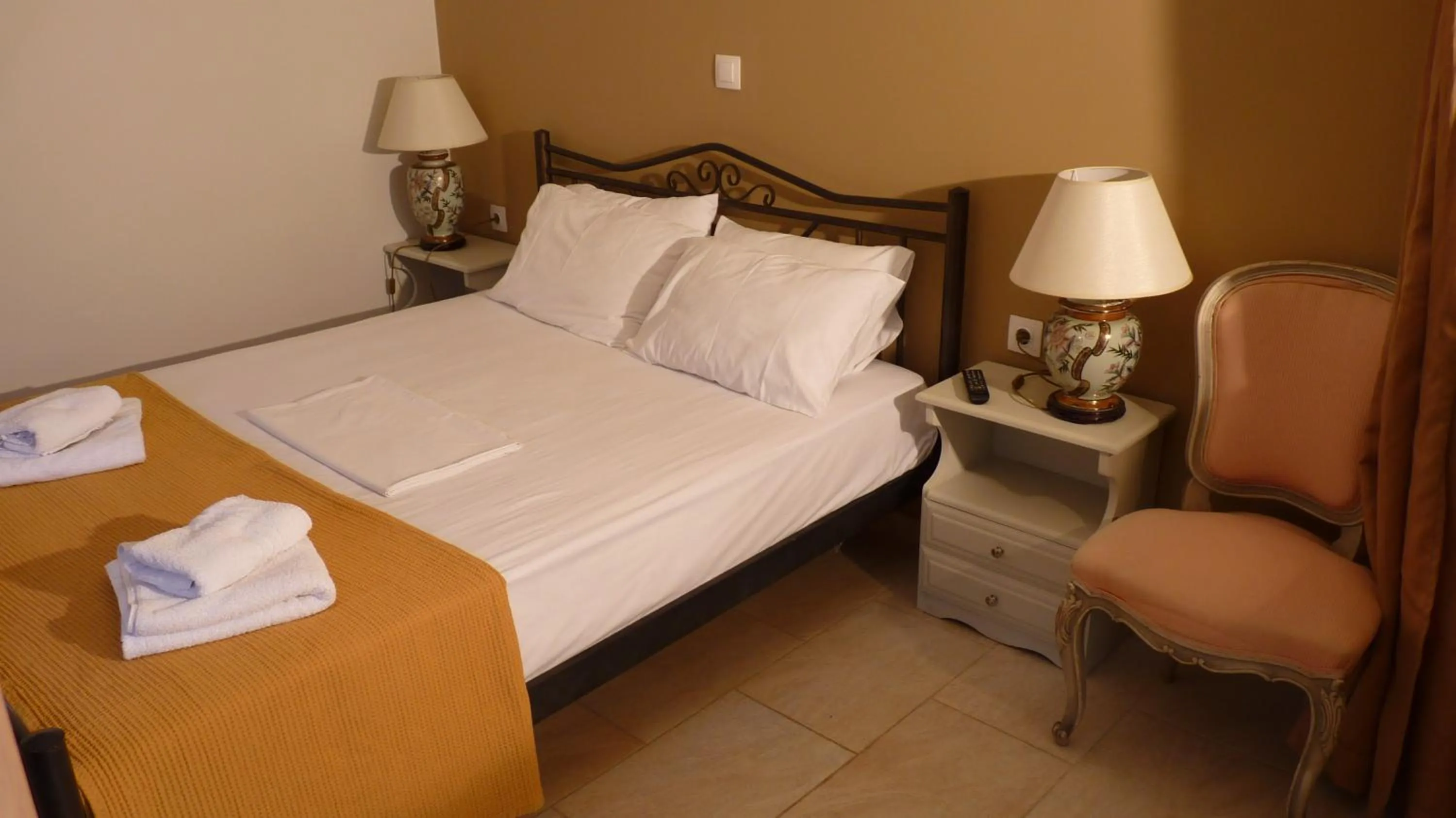 Bed in Apagio Apartments