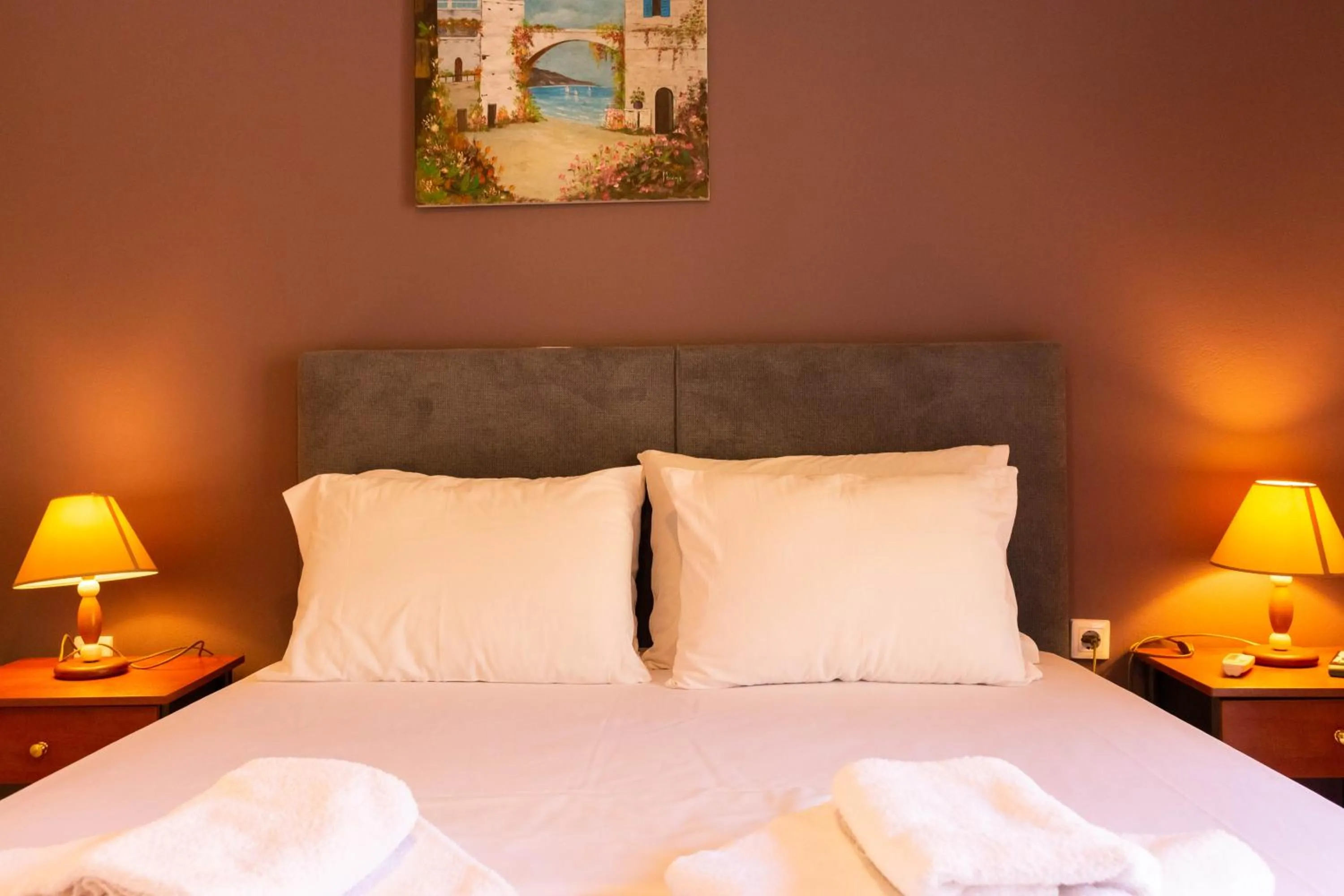 Bed in Apagio Apartments