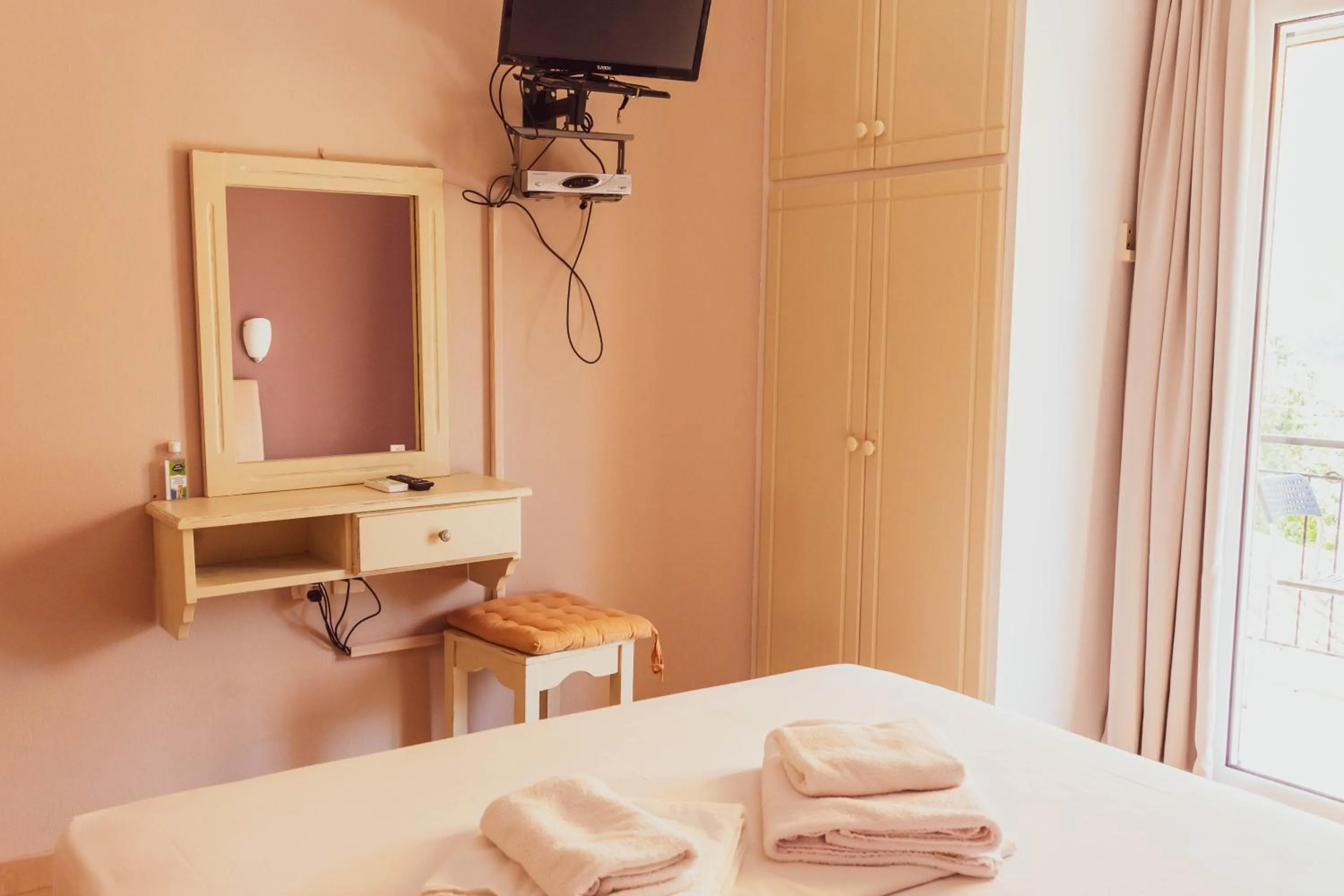 Bed in Apagio Apartments
