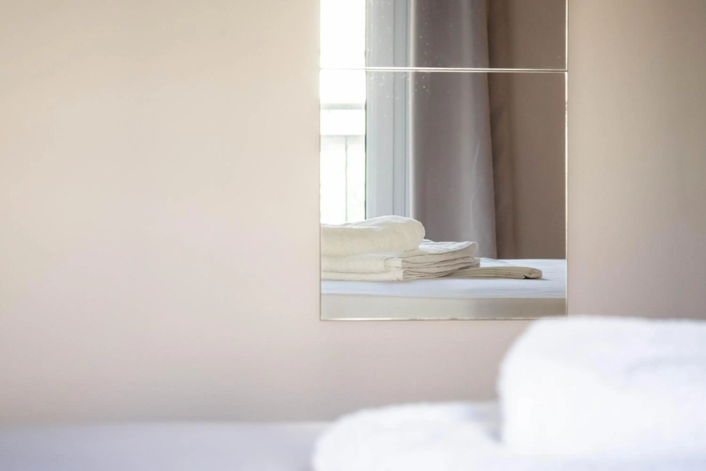 Bed in Apagio Apartments