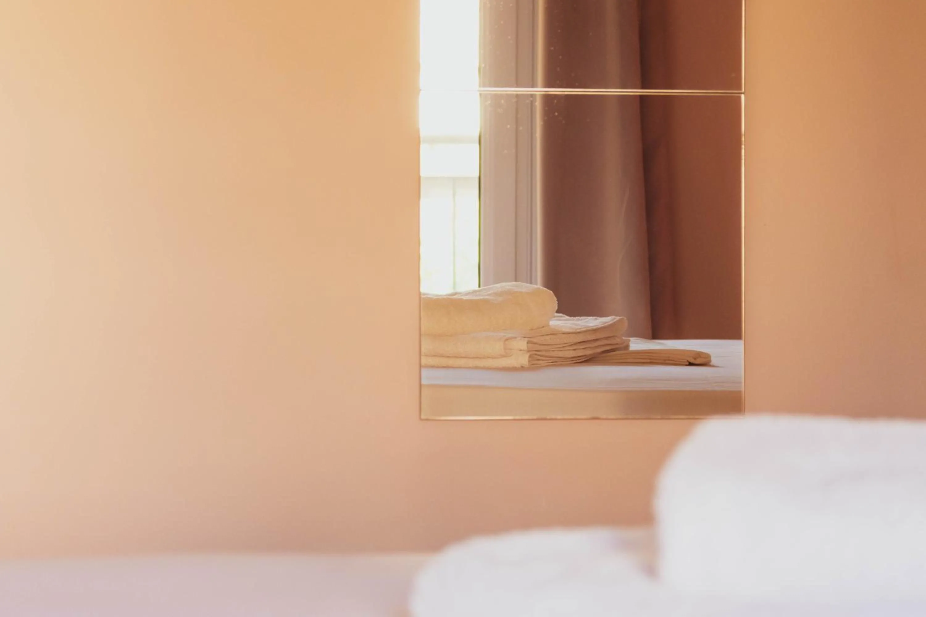 Bed in Apagio Apartments