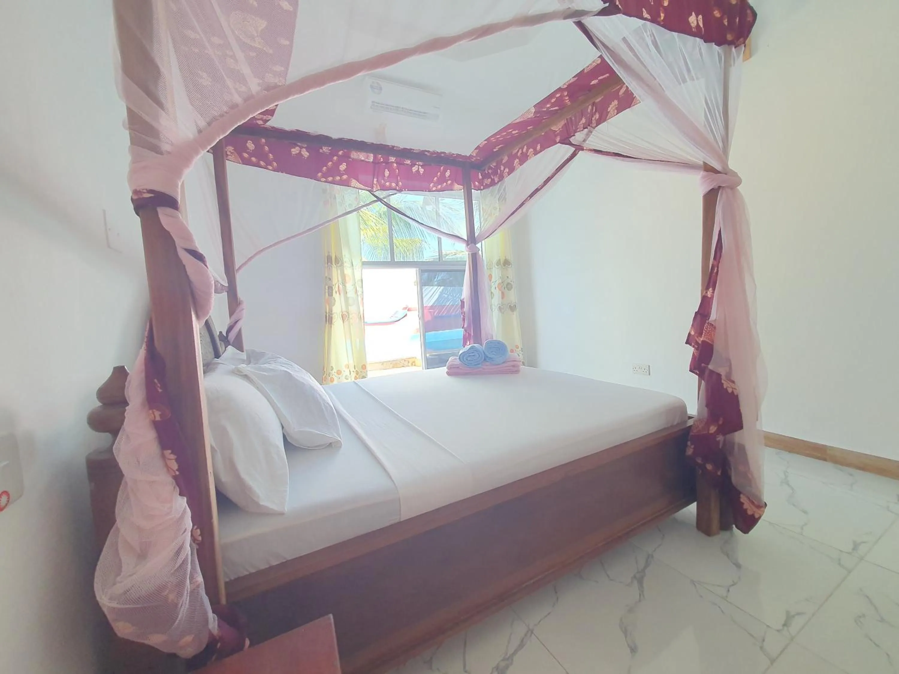 Bed in BARIDI VILLA