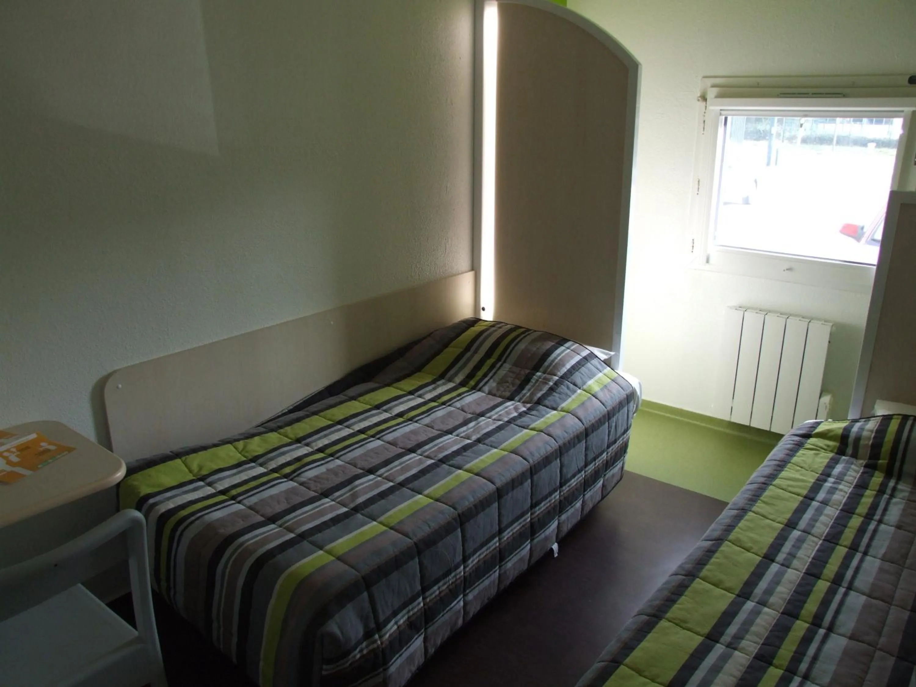 Bed in hotelF1 Blois