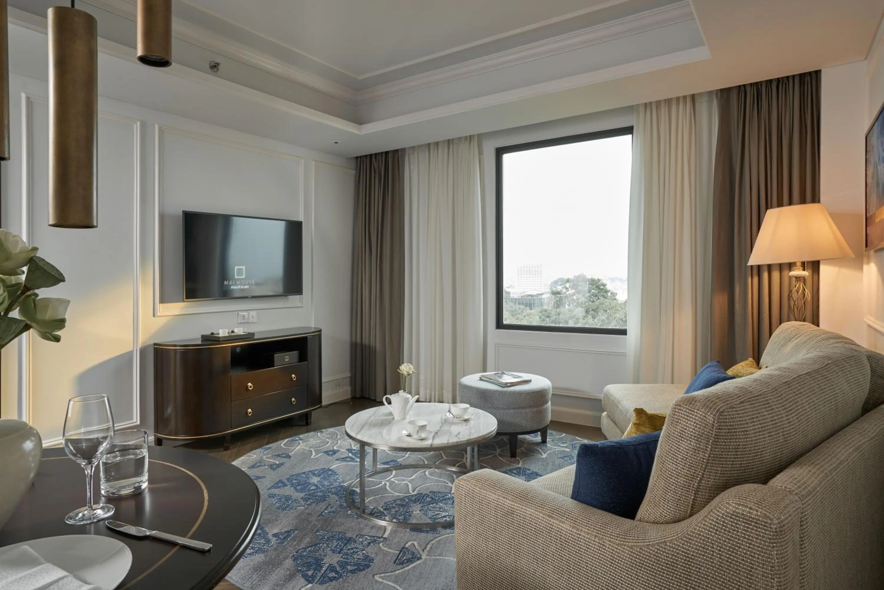 Communal lounge/ TV room in Mai House Saigon Hotel