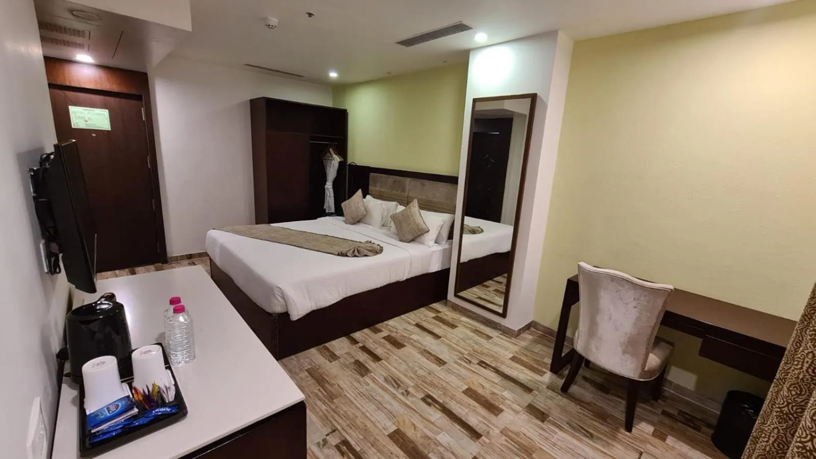 Coffee/tea facilities, Bed in Regenta Inn Ranip Ahmedabad