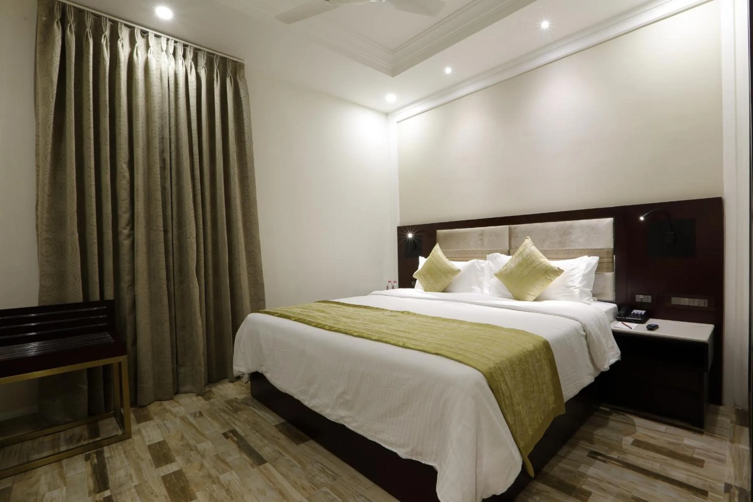 Photo of the whole room, Bed in Regenta Inn Ranip Ahmedabad