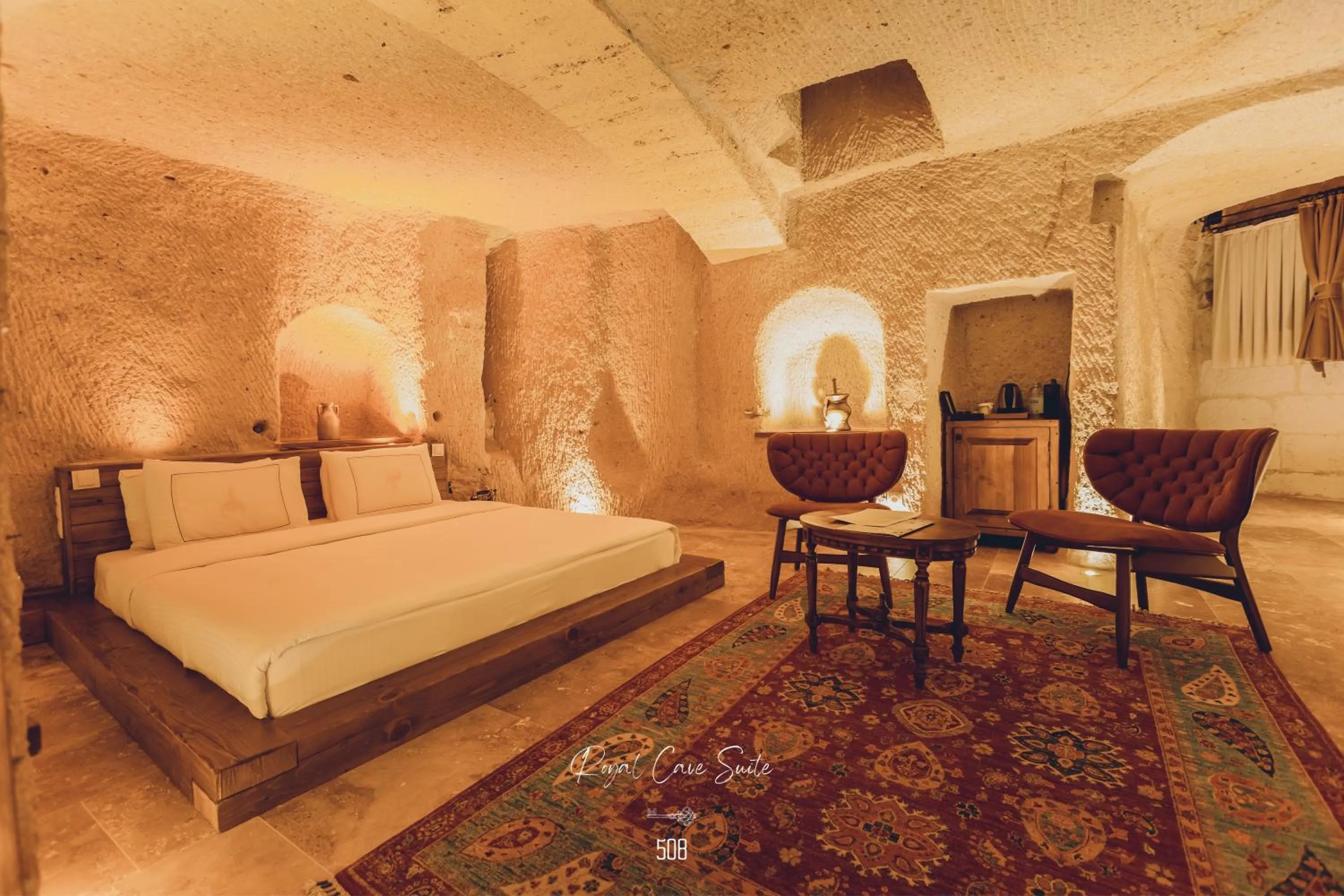 Bed in Nino Cave Suites