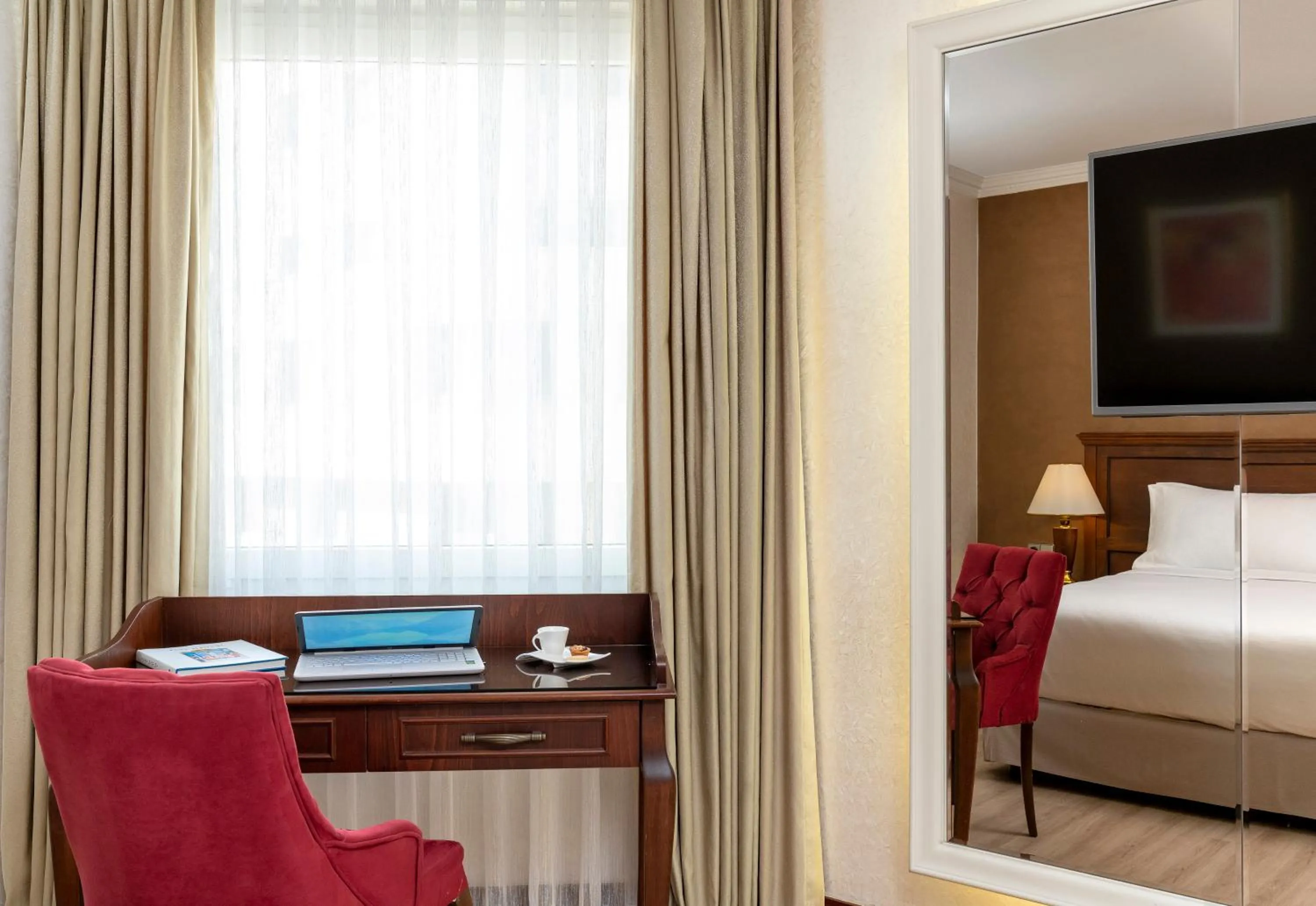 Seating area, Bed in Occidental Taksim