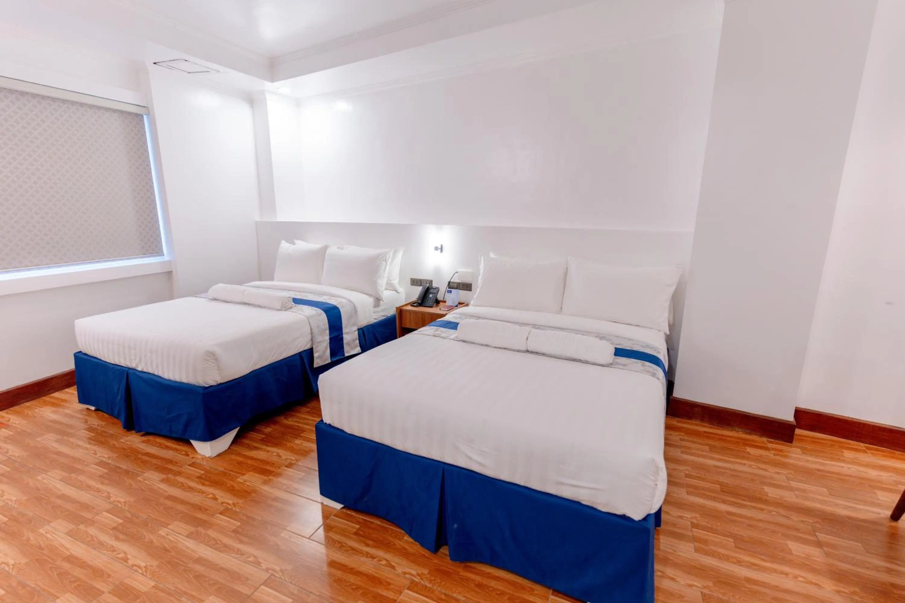 Bed in Santiago Cove Hotel and Restaurant