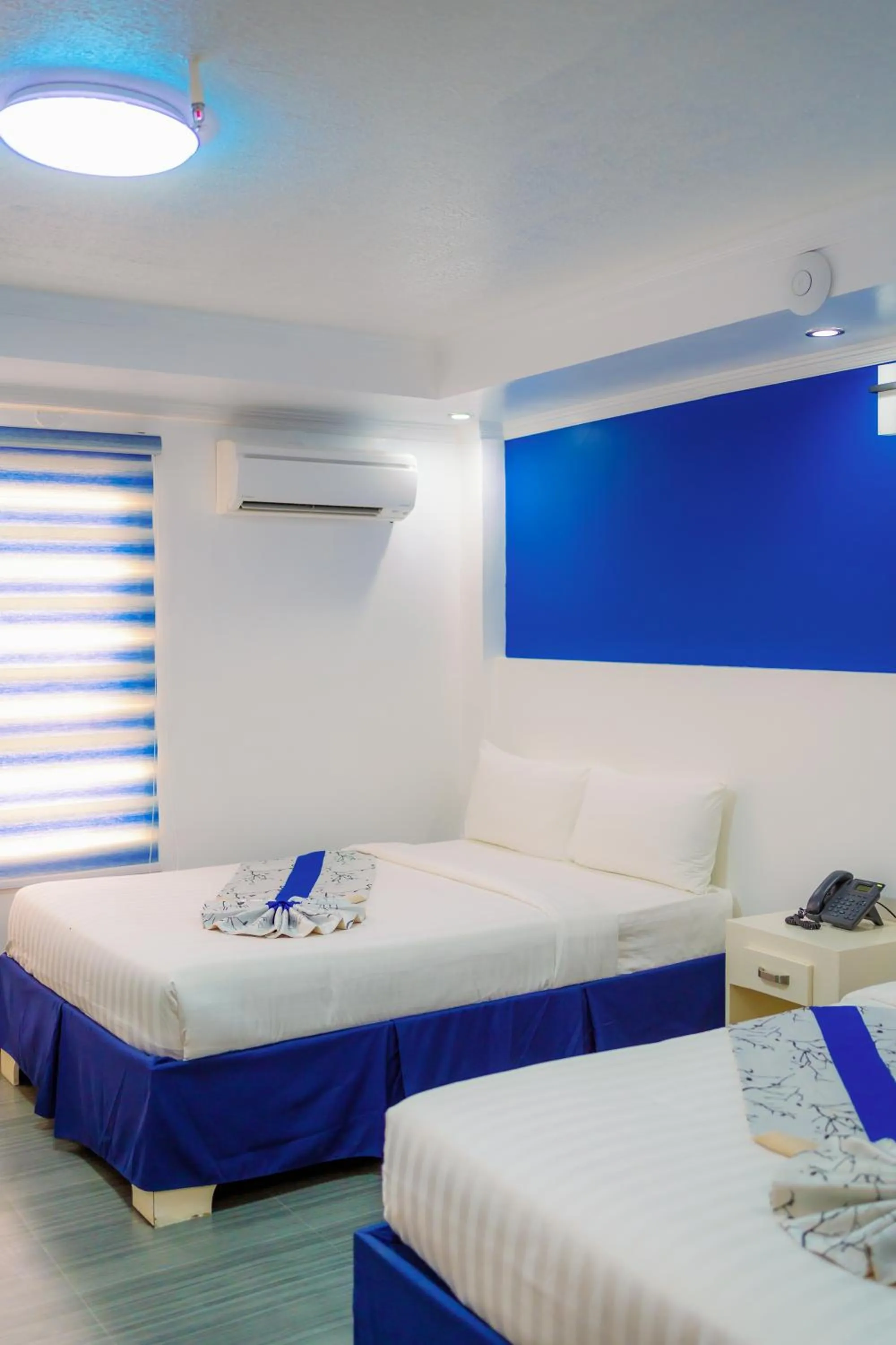 Bed in Santiago Cove Hotel and Restaurant