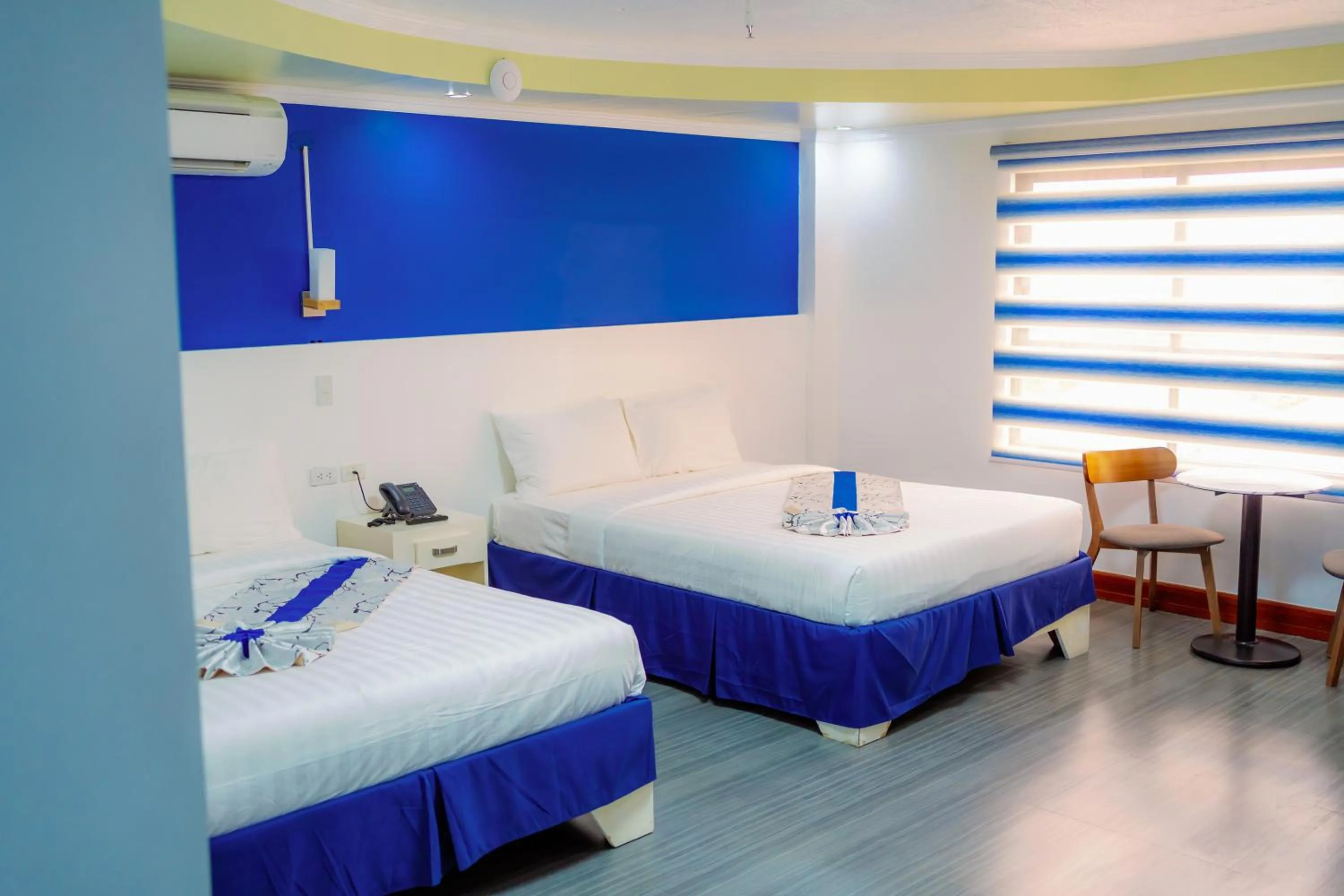 Bed in Santiago Cove Hotel and Restaurant