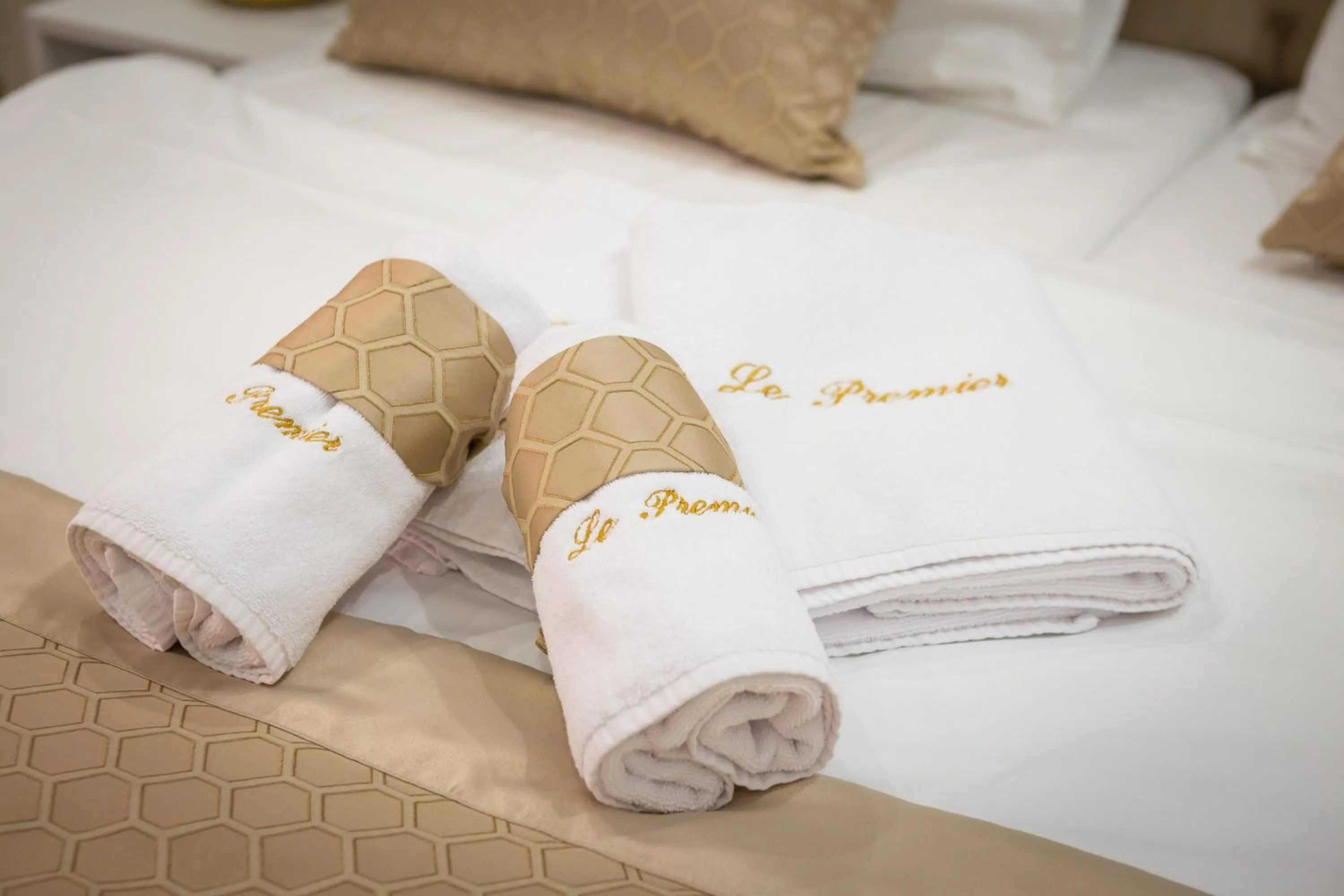 towels, Bed in Le Premier Luxury Rooms