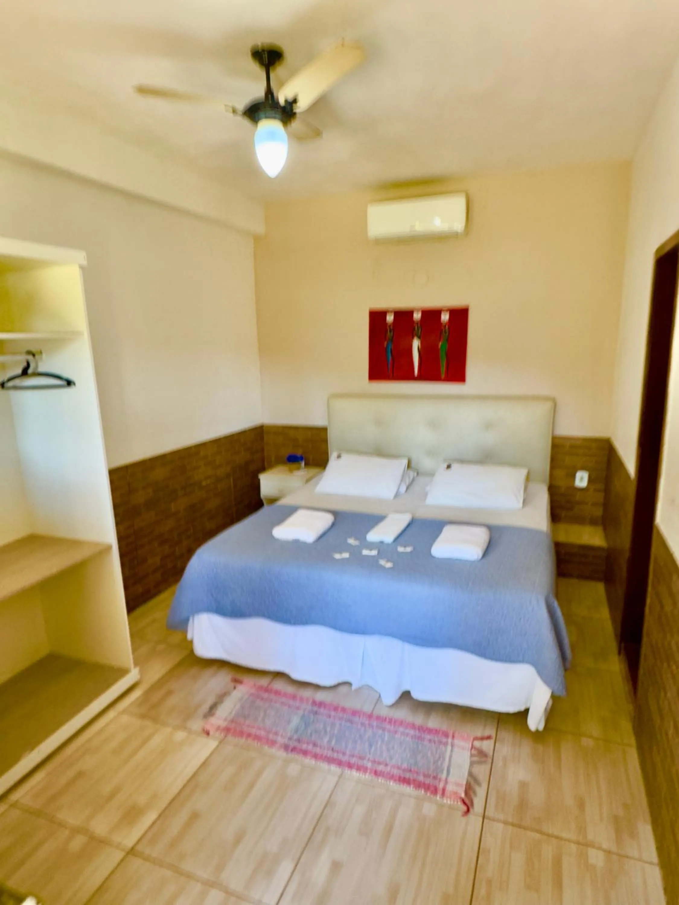 Bed in Pousada Três Pescadores