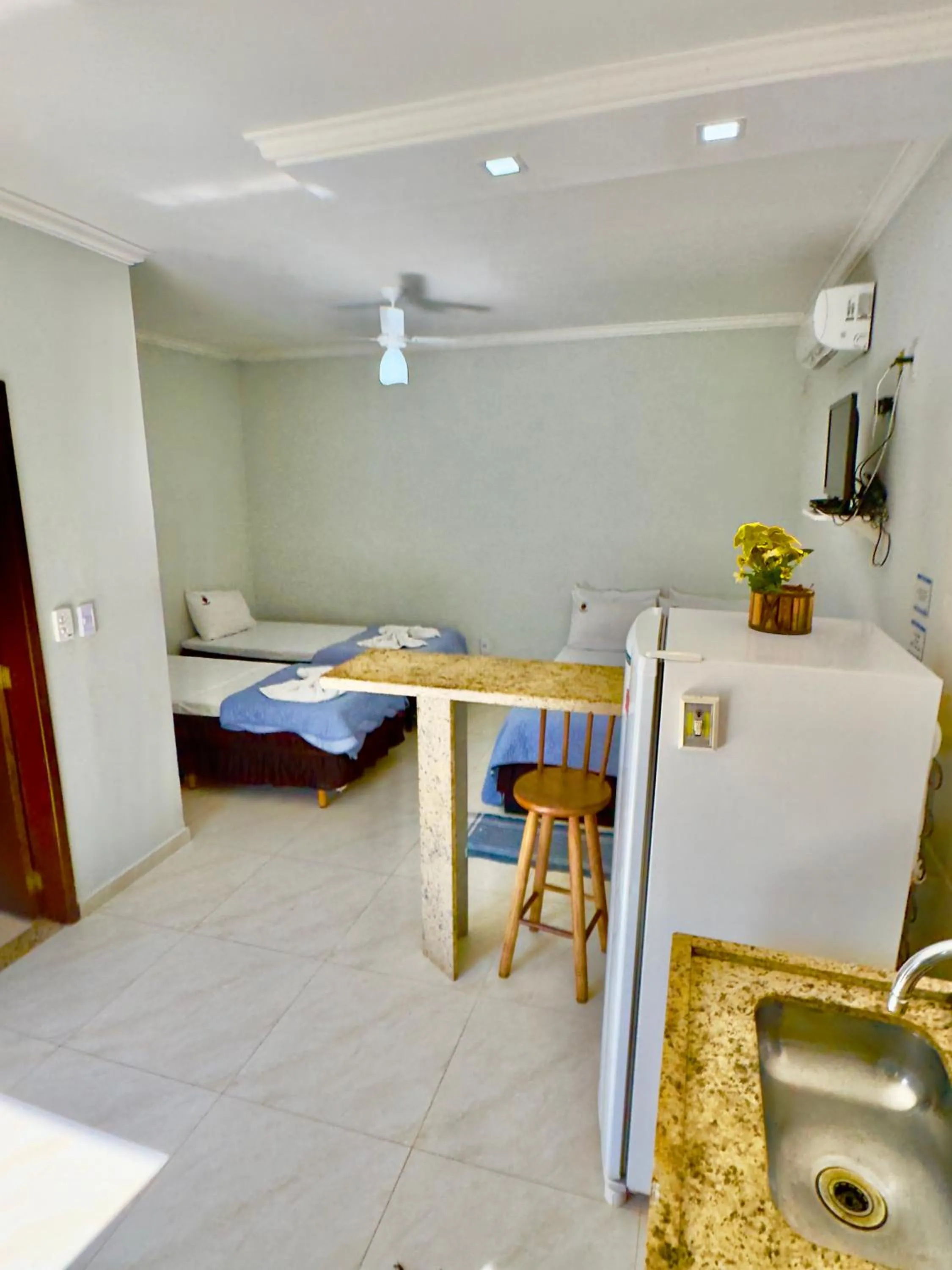 Bed in Pousada Três Pescadores