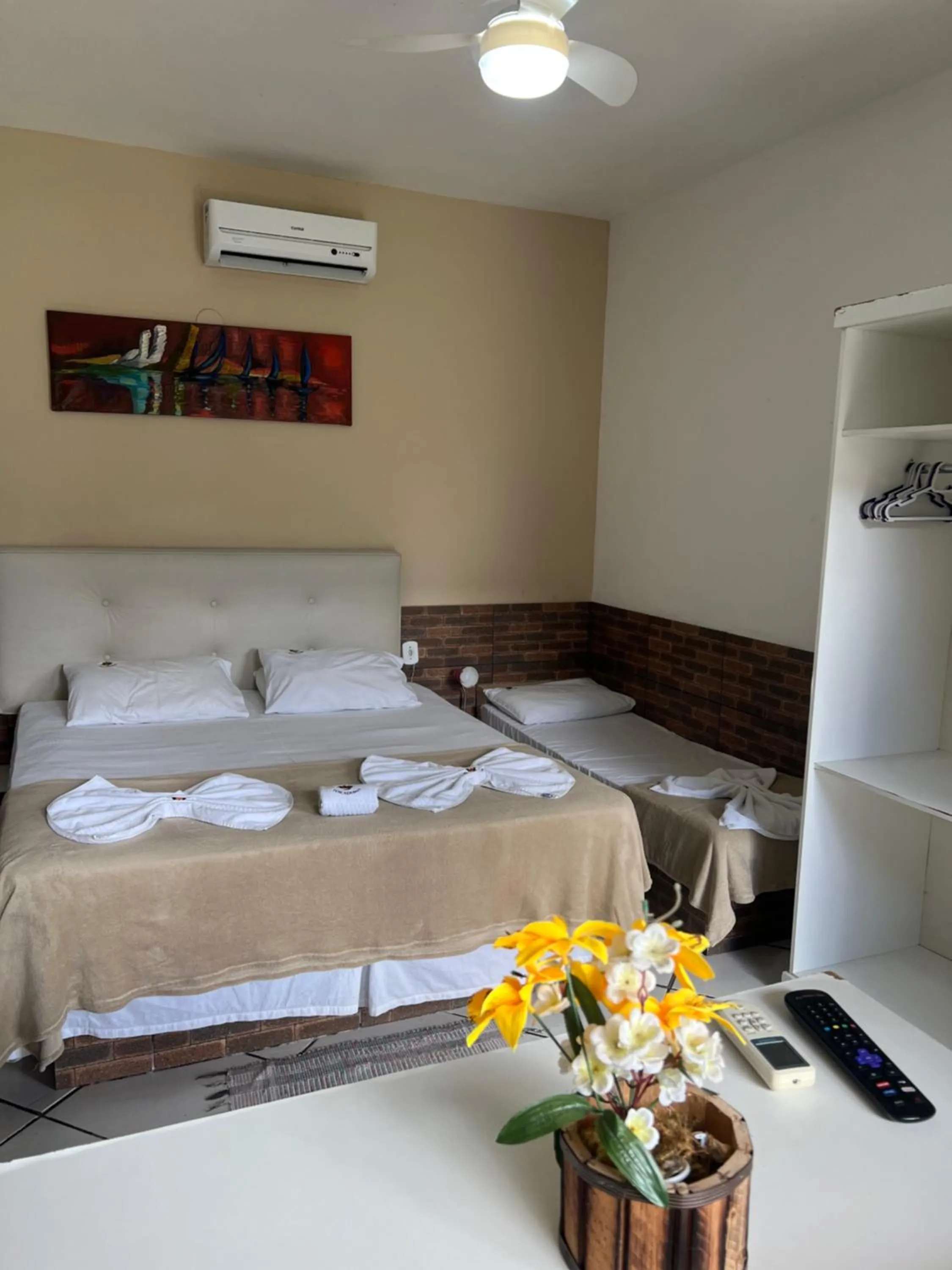 Bed in Pousada Três Pescadores