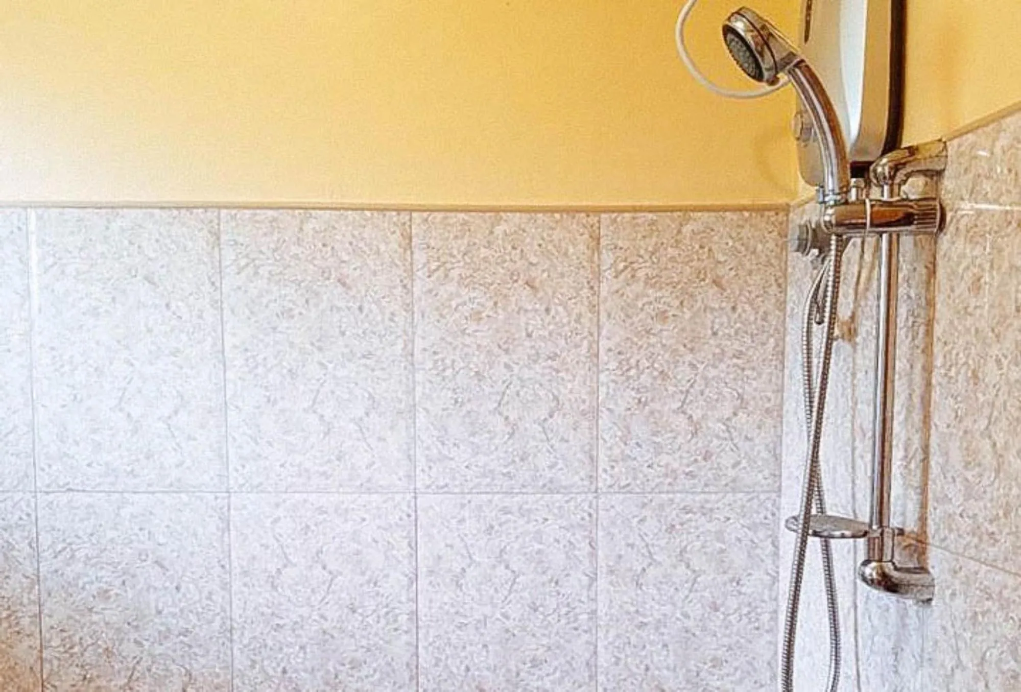 Shower in RedDoorz at Shandy's Transient House Palompon