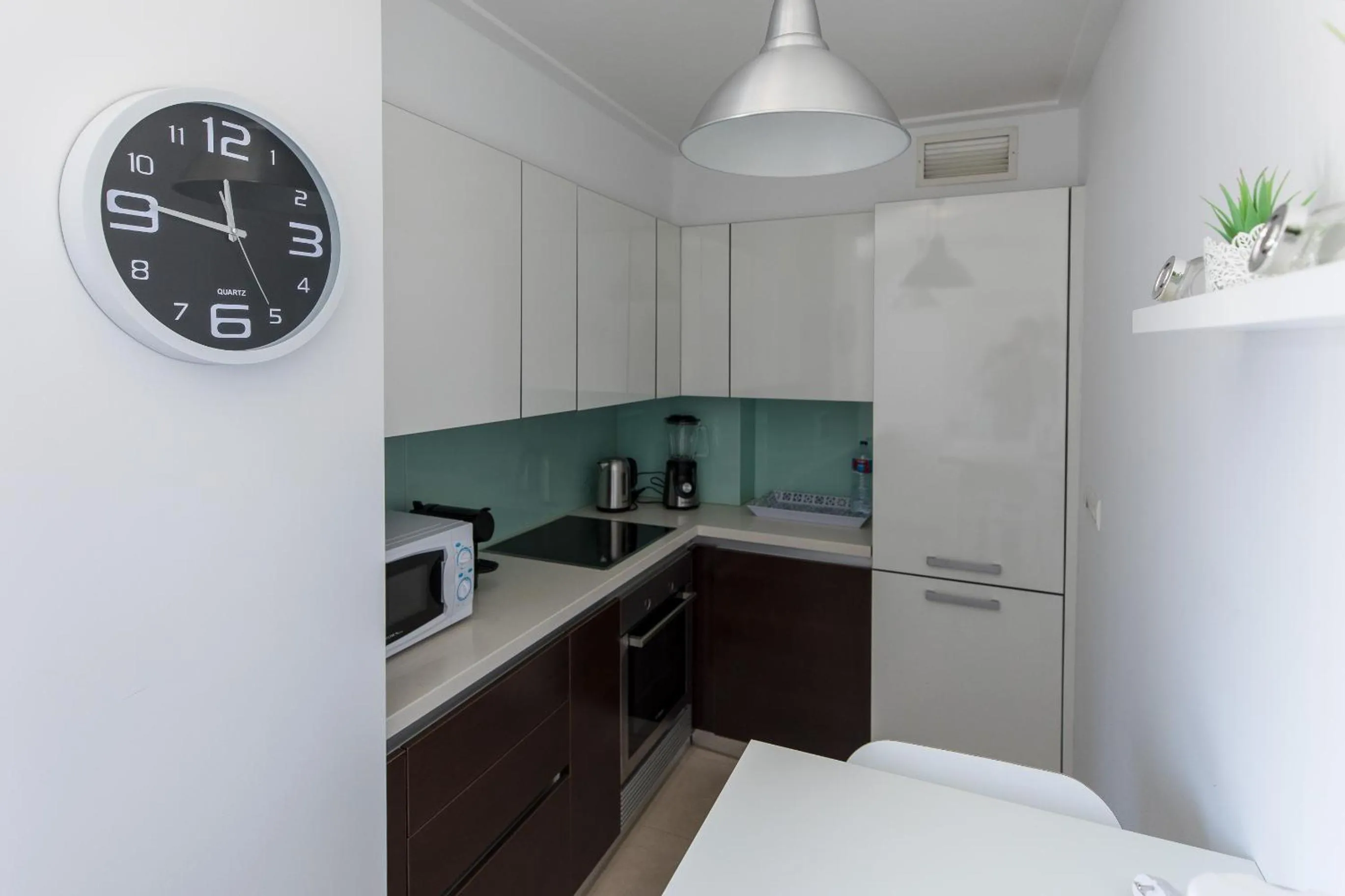 Kitchen or kitchenette in Charming Apartment with Balcony & Pool