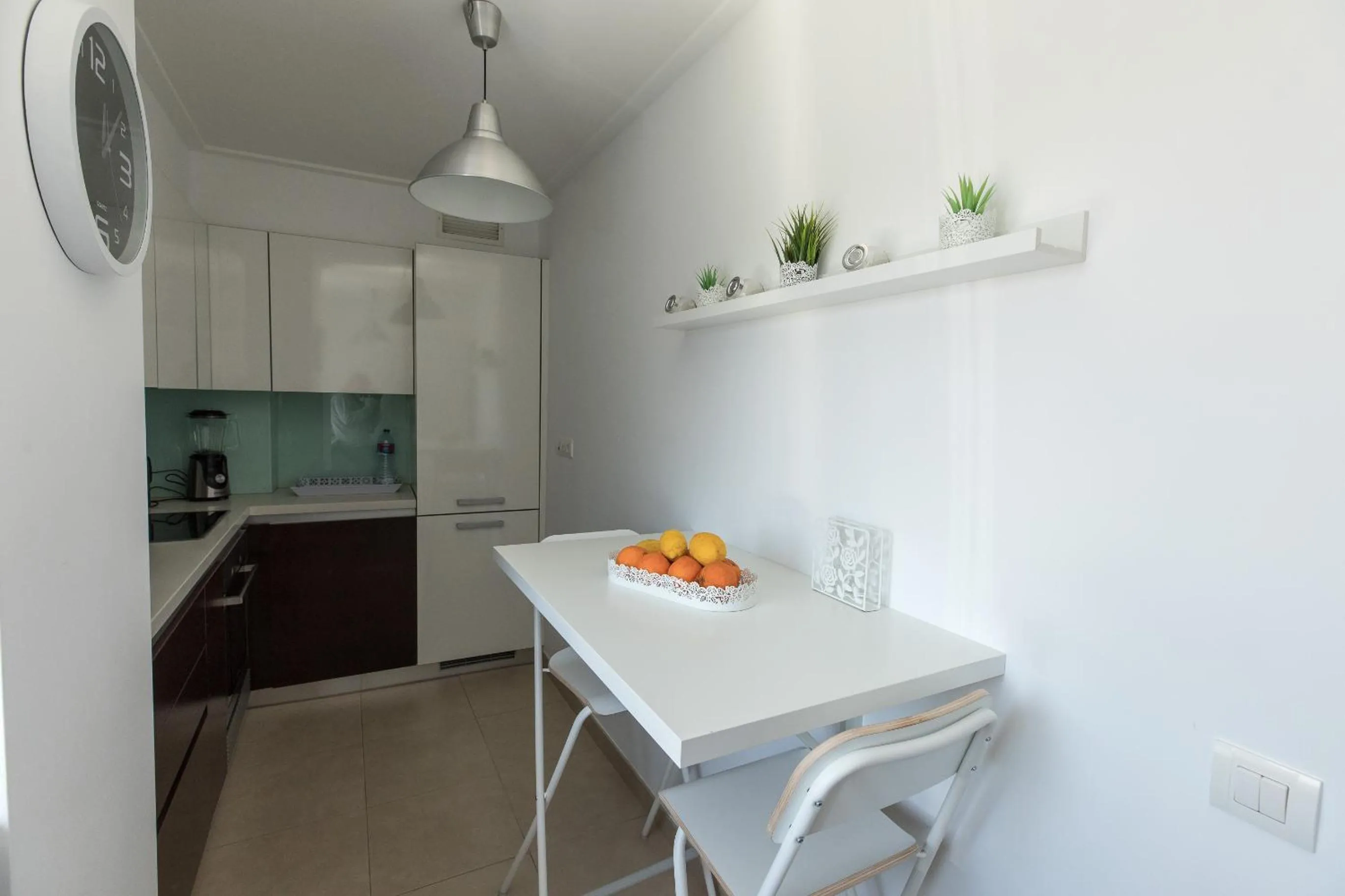 Kitchen or kitchenette in Charming Apartment with Balcony & Pool