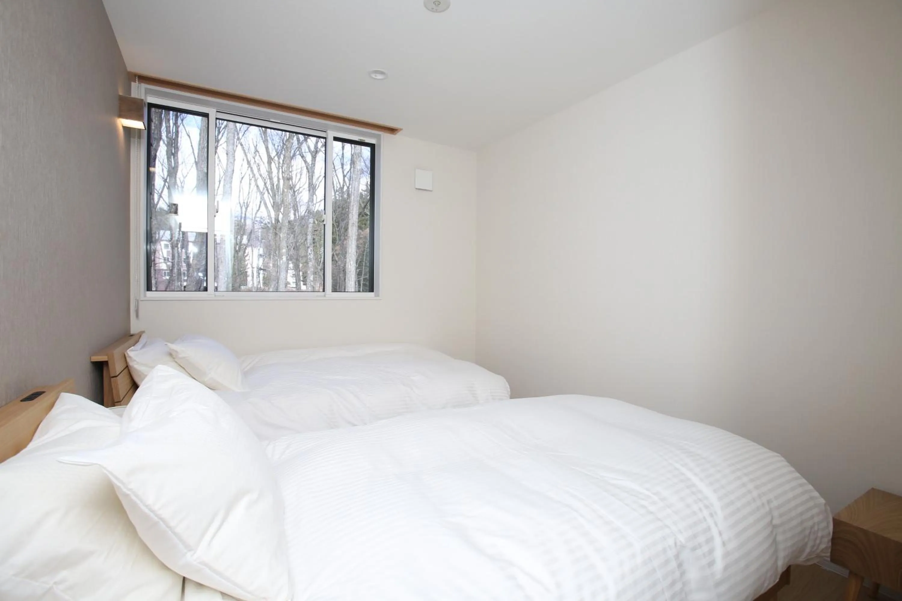 Bed in The Seasons Apartments Hakuba