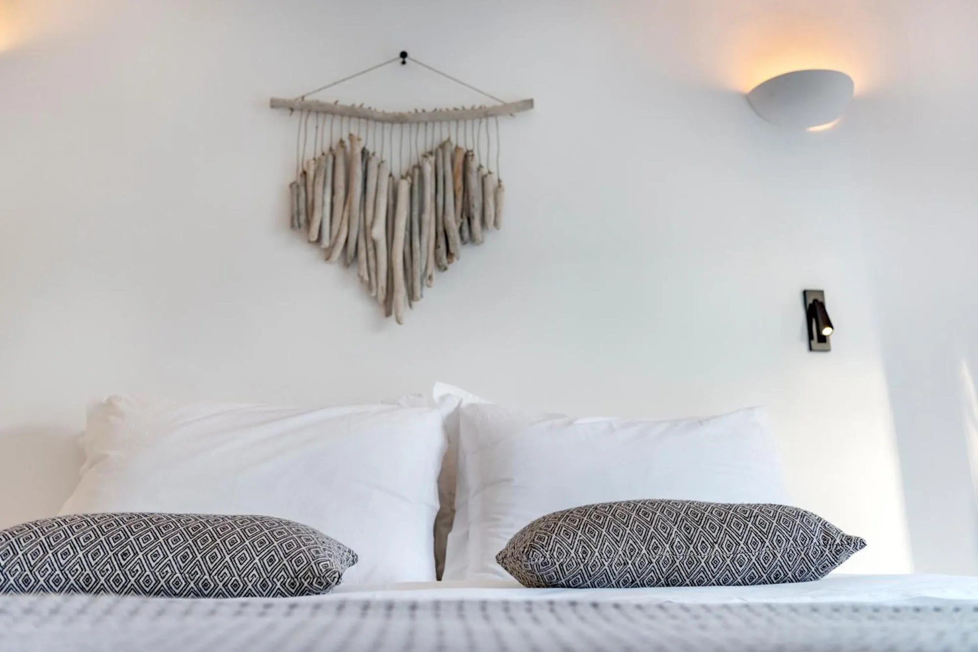 Bed in Mykonian Mews Luxury Suites