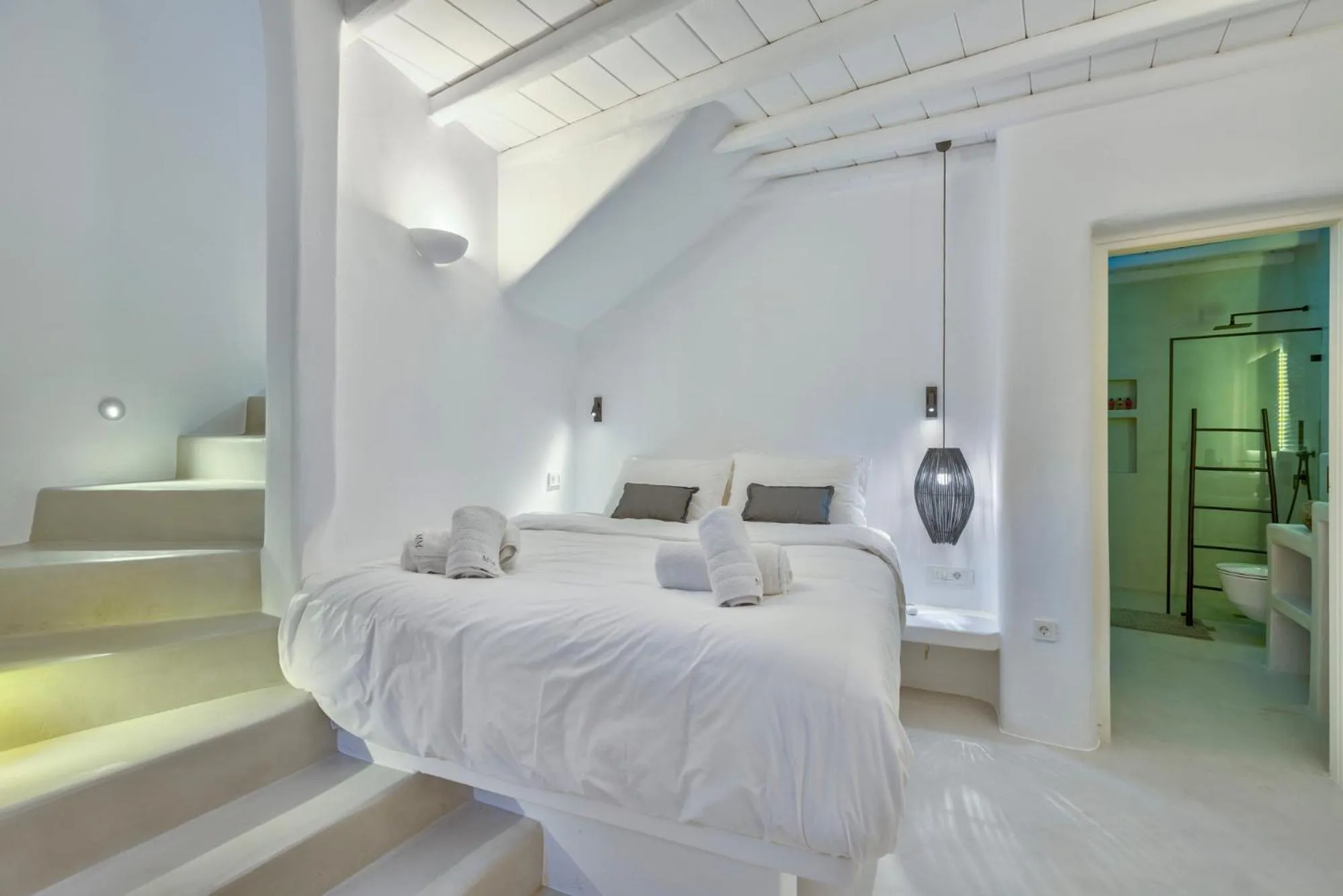 Bed in Mykonian Mews Luxury Suites