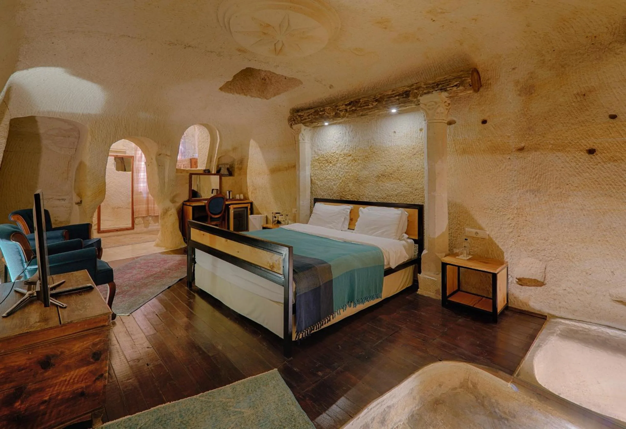 Bed in Taru Cave Suites