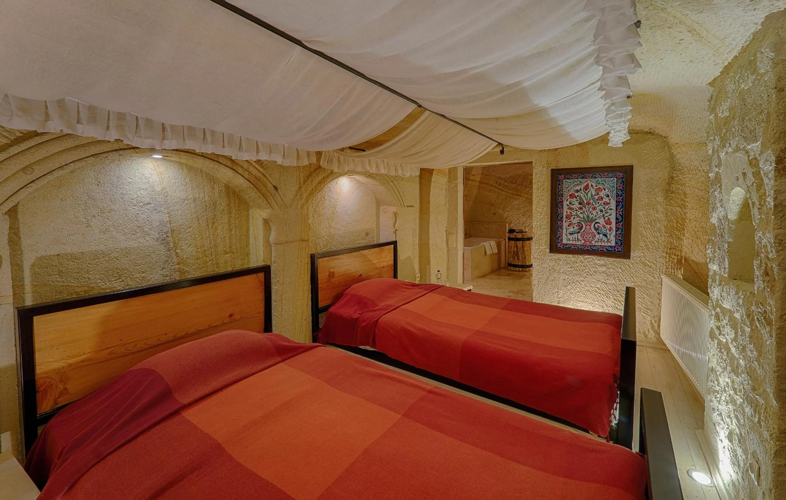Bed in Taru Cave Suites