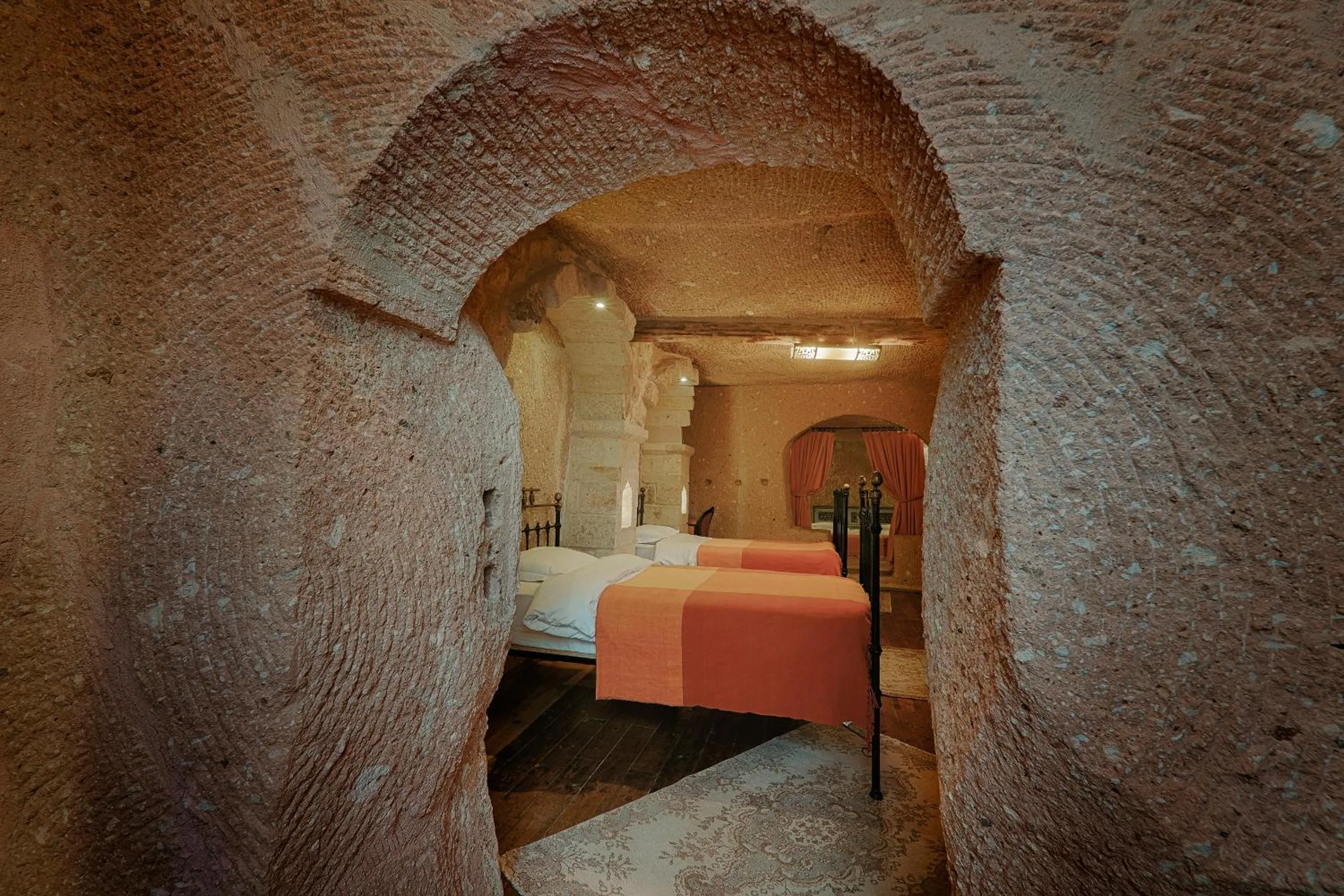Bed in Taru Cave Suites