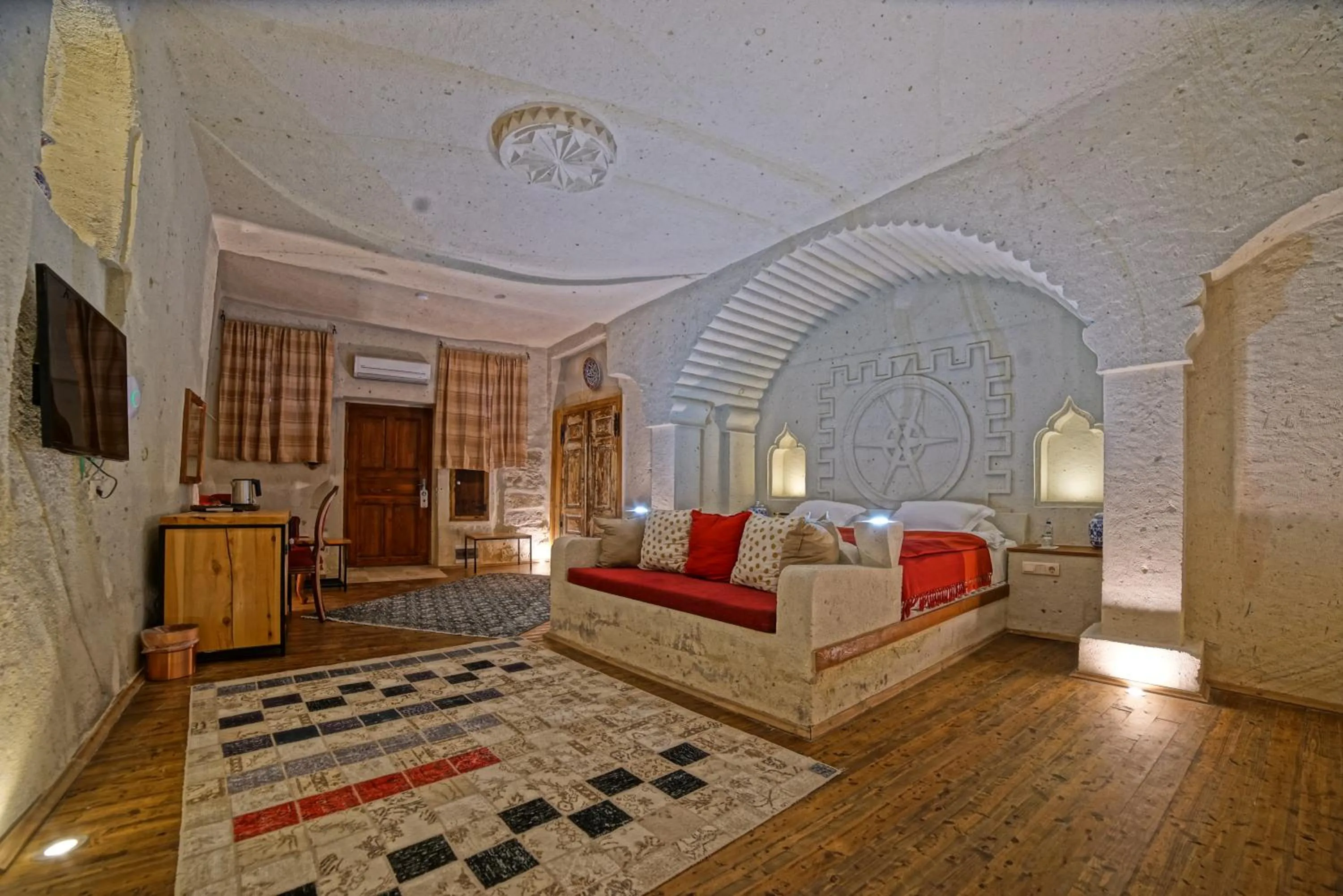 Bed in Taru Cave Suites