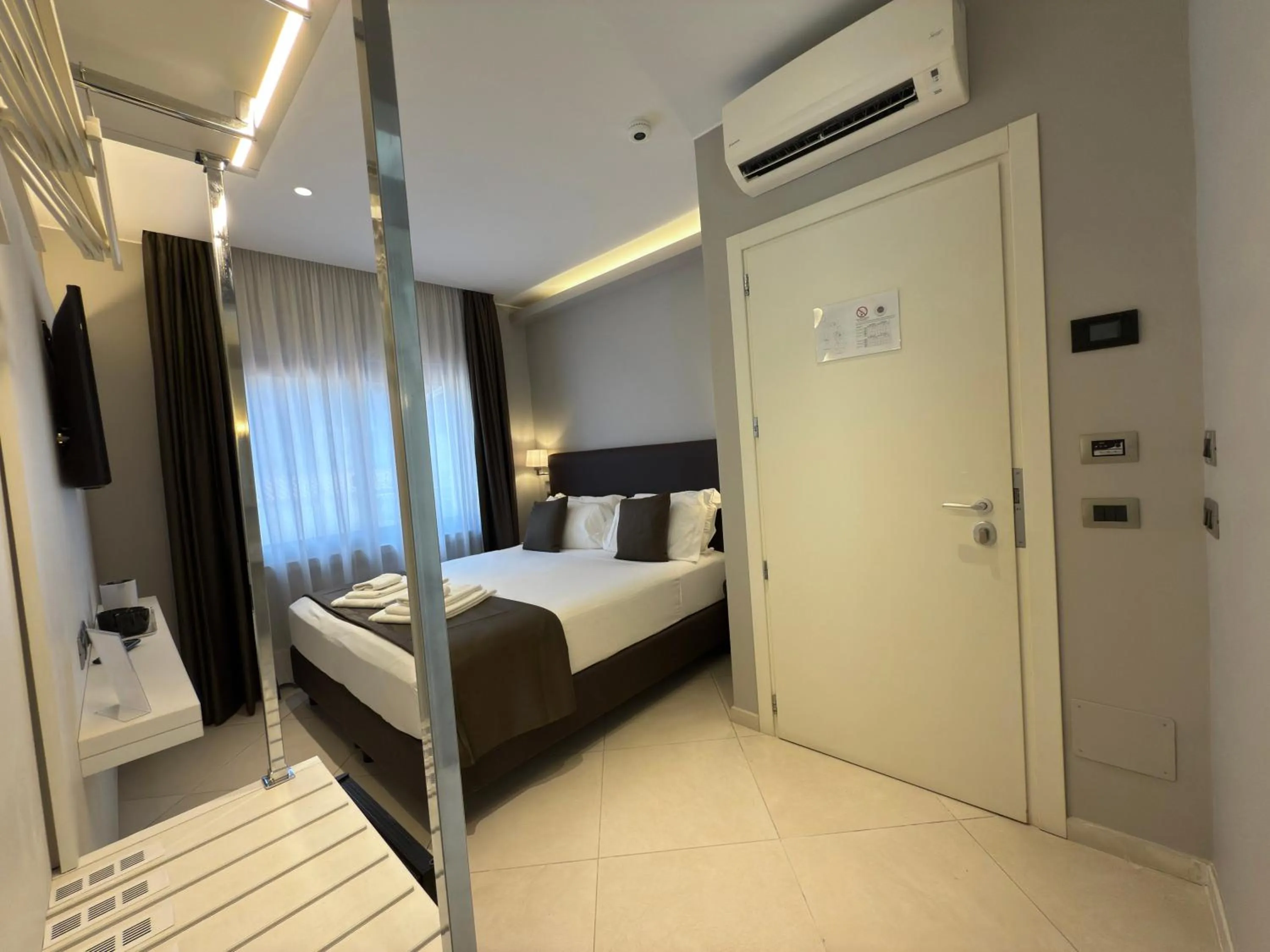 Bed in ETNEA STYLE CATANIA LUXURY ROOMS