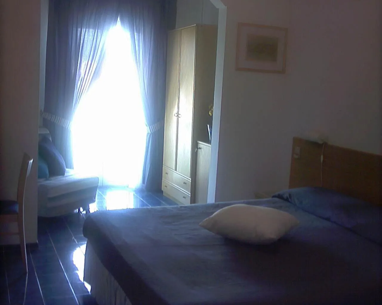 Bedroom in Hotel La Baia