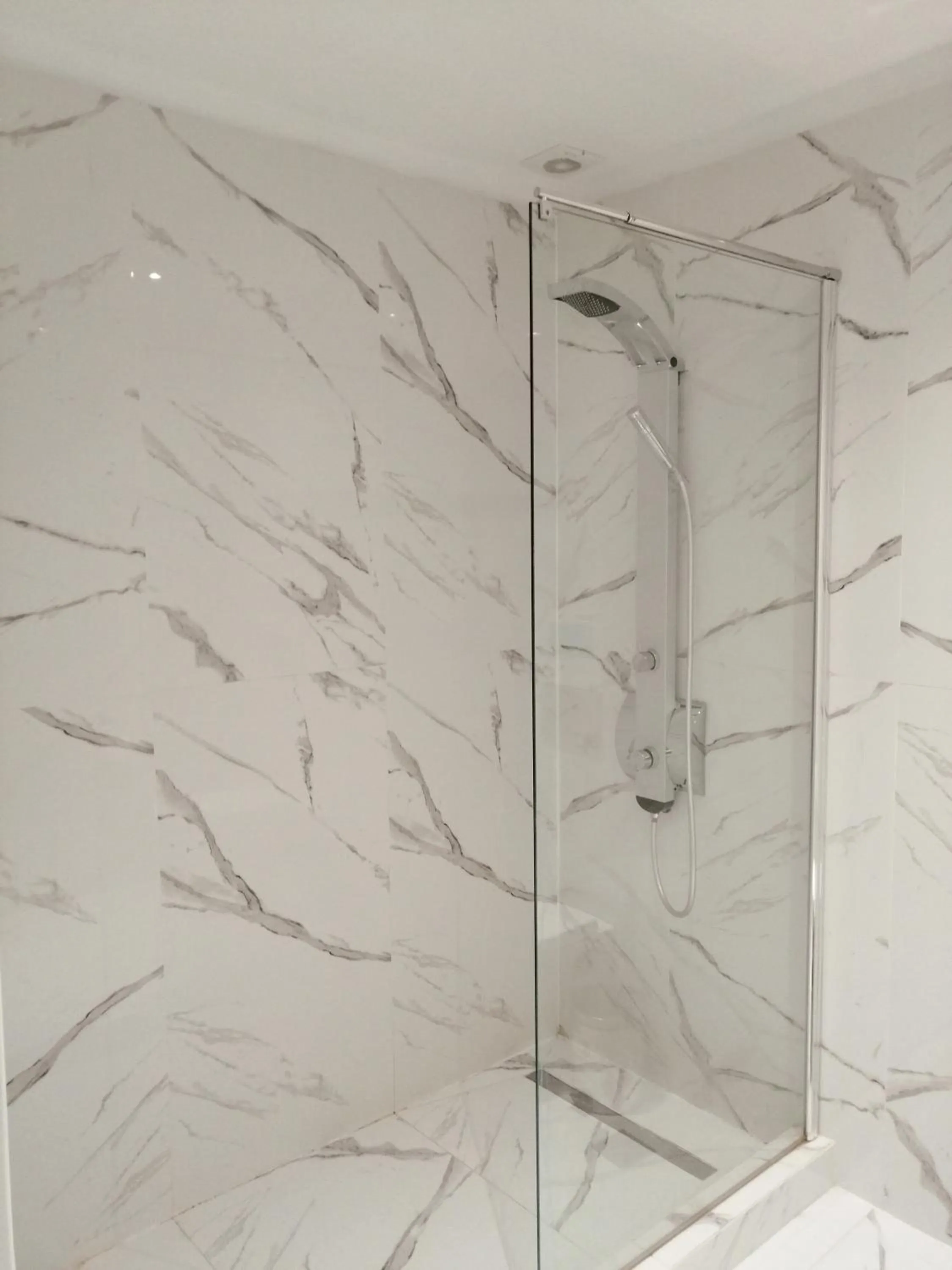 Shower in 24K Athena Suites