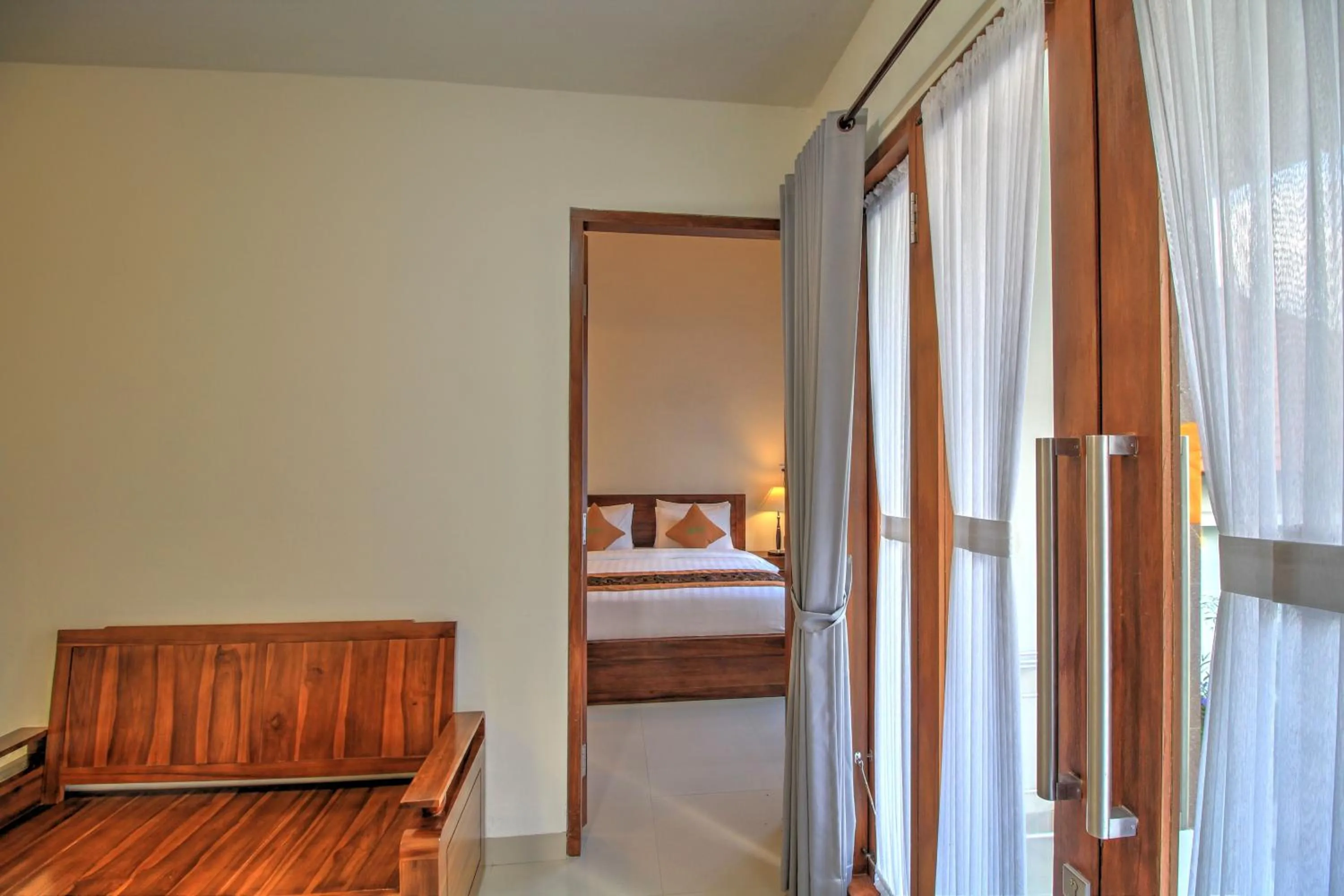 Seating area, Bed in Arya Resort Nusa Penida