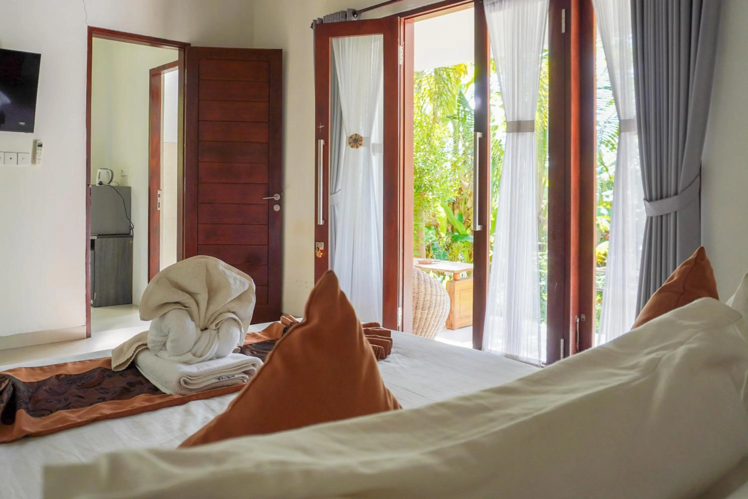 towels, Bed in Arya Resort Nusa Penida
