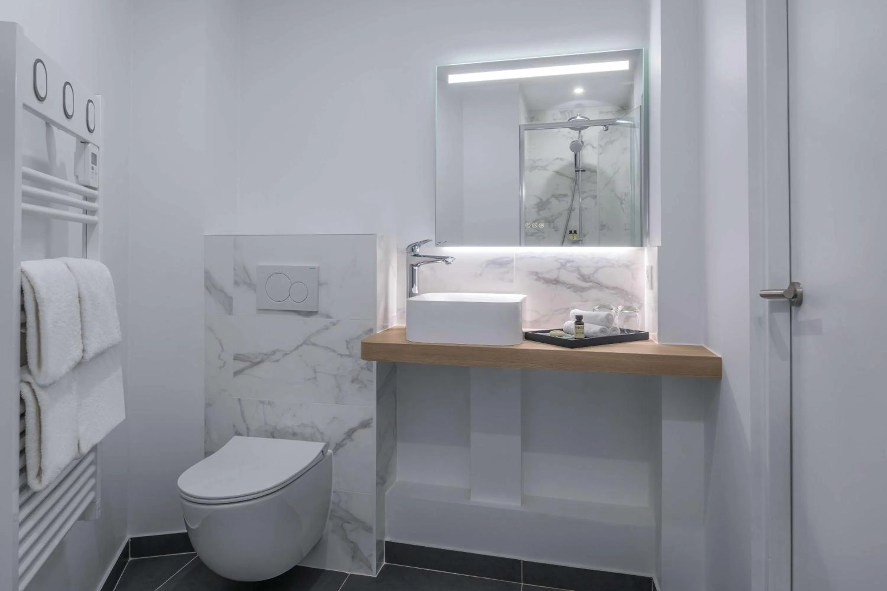 Toilet in Hotel Camille Paris Tapestry Collection by Hilton