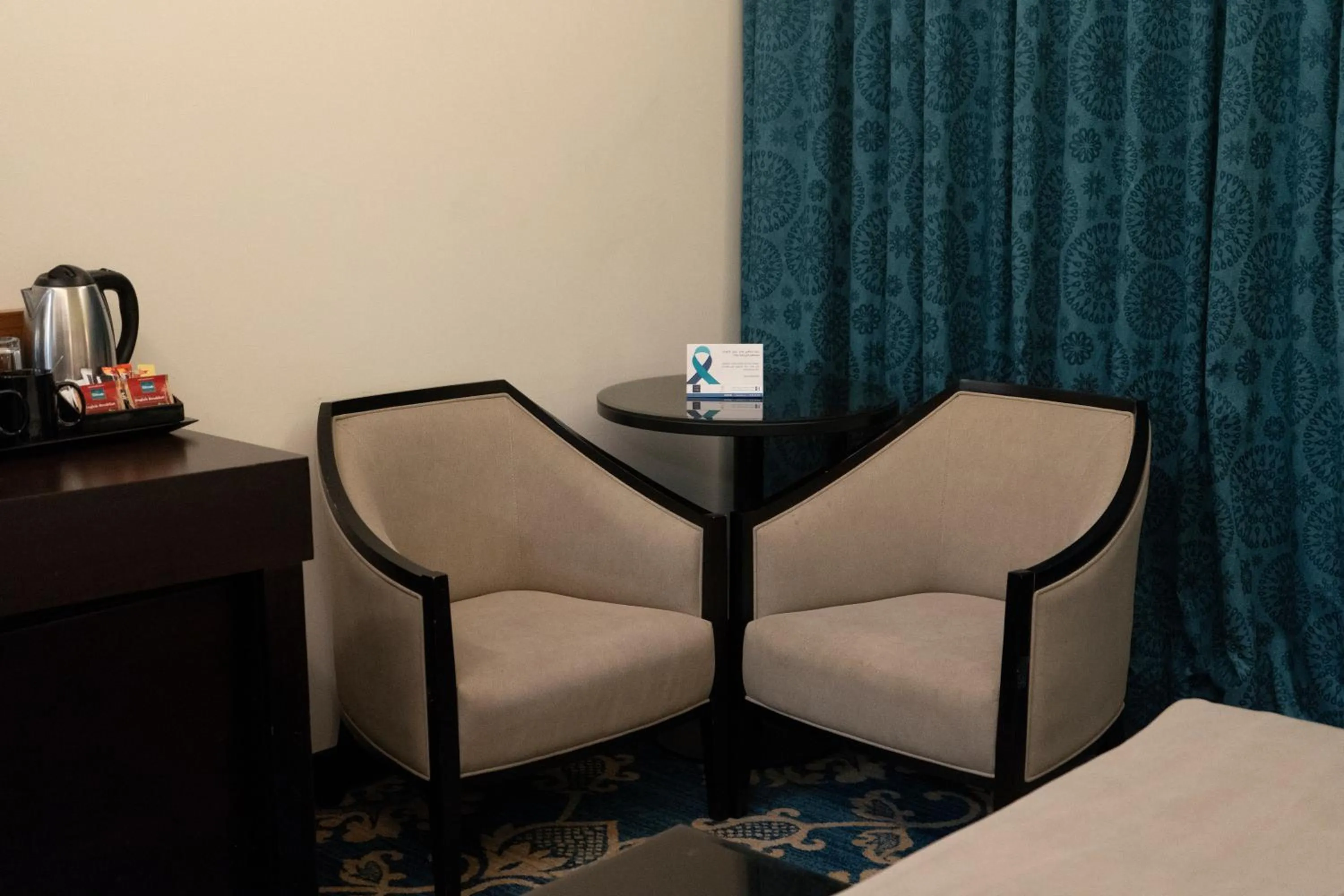 Seating area in Corp Amman Hotel