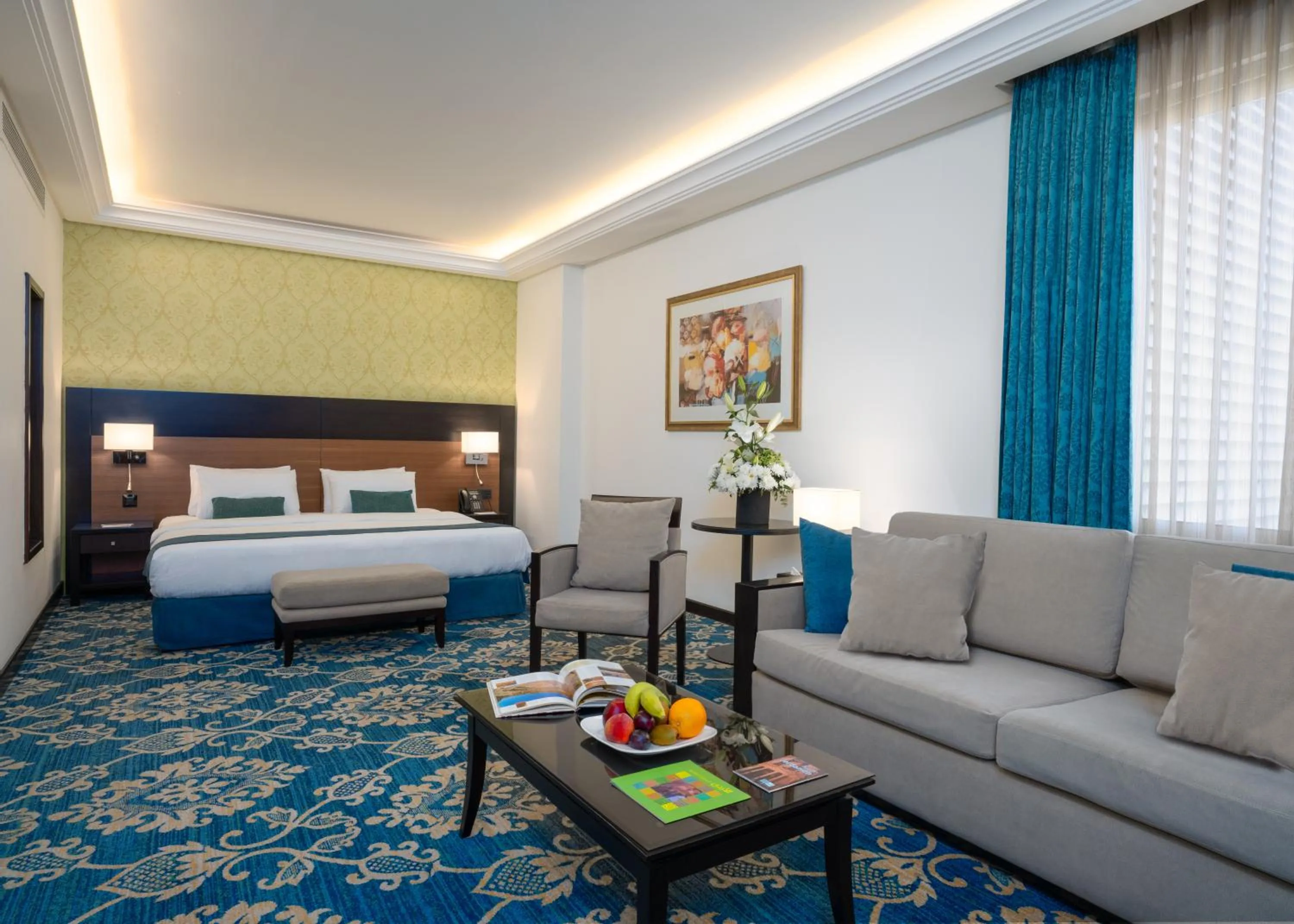 Seating area, Bed in Corp Amman Hotel