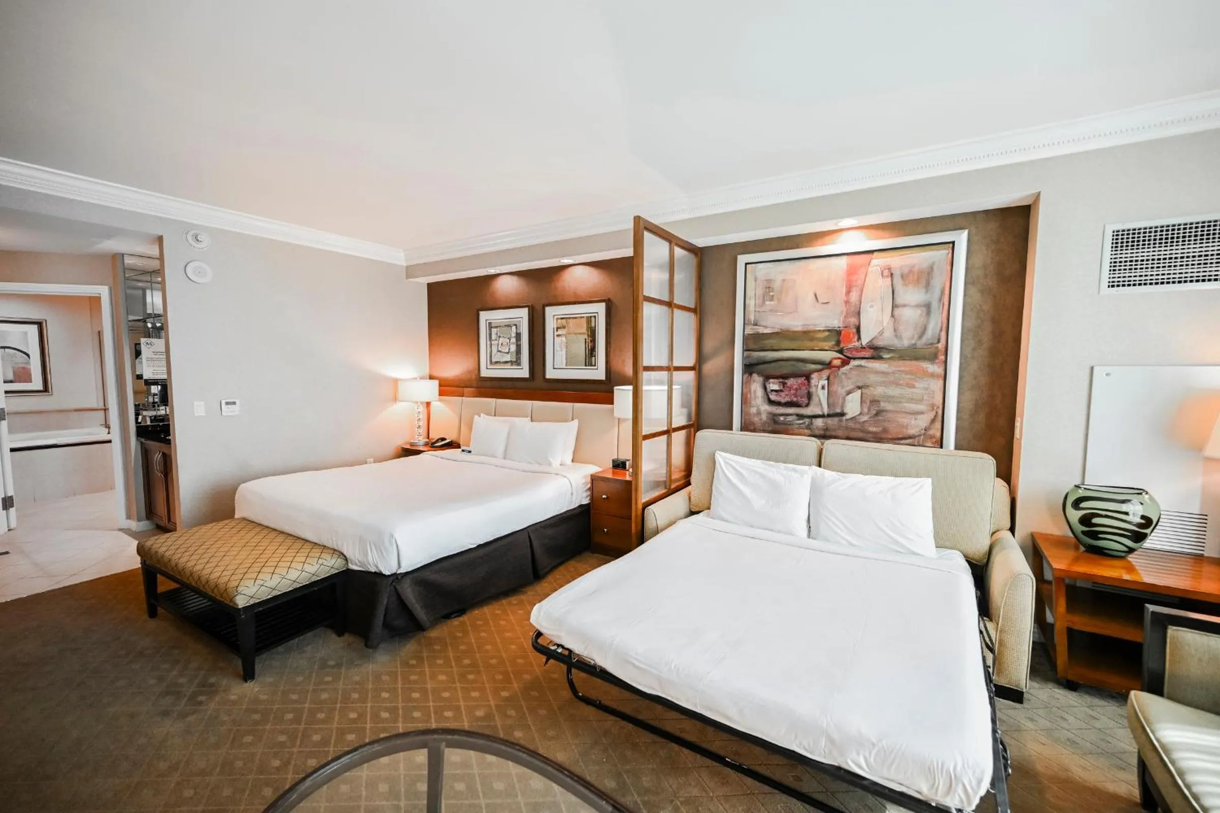 Bed in StripViewSuites Penthouse Two-Bedroom Conjoined Suite