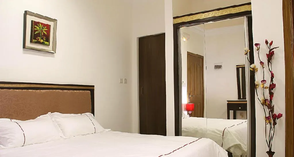 Bed in Golden Rose Hotel