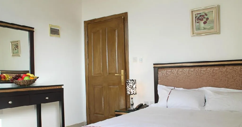 Bed in Golden Rose Hotel