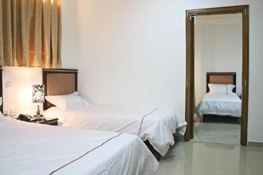 Bed in Golden Rose Hotel