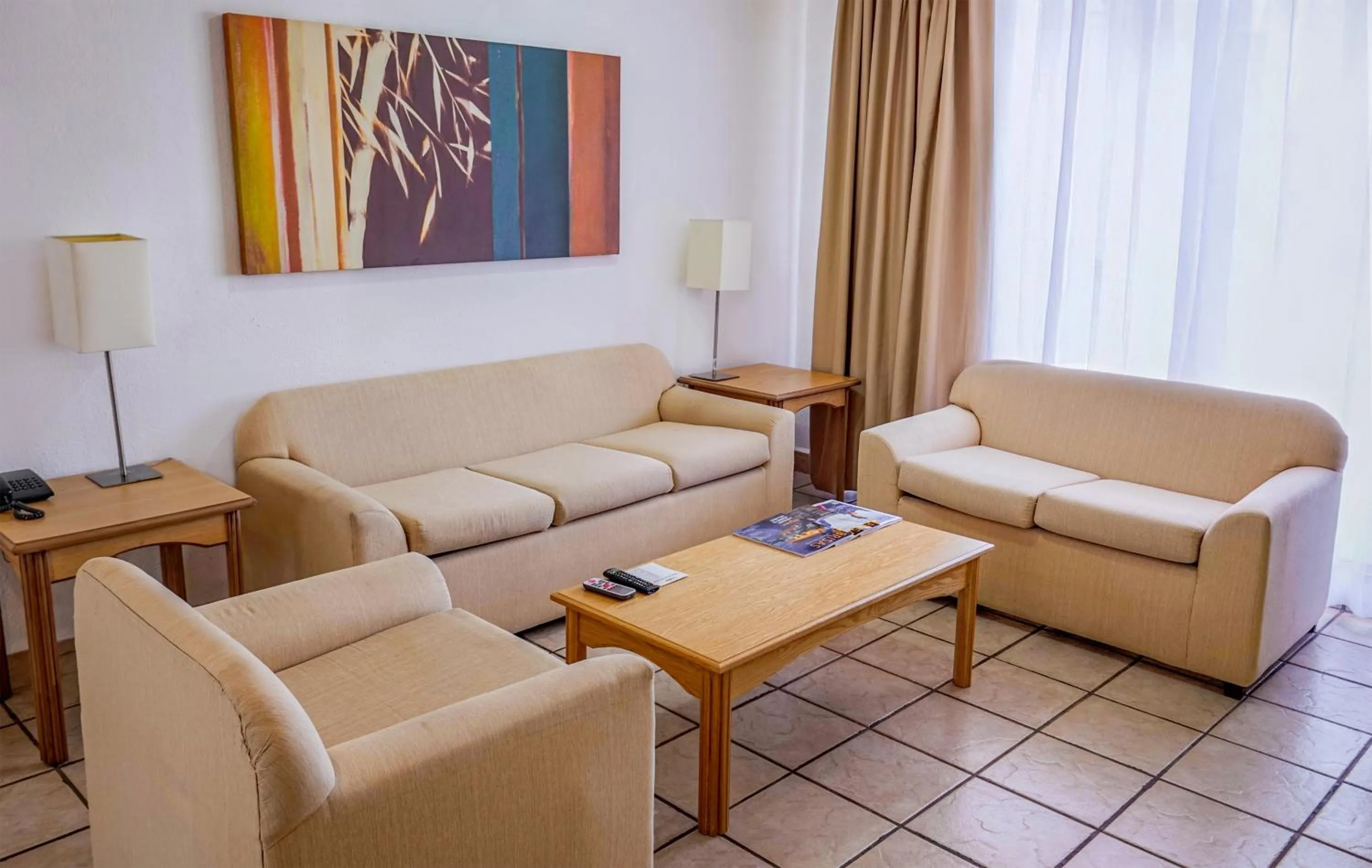 Living room in Sunrock Hotel & Suites