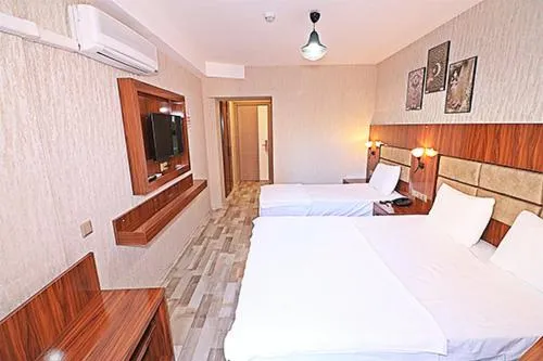 Bed in MARİNA HOTEL