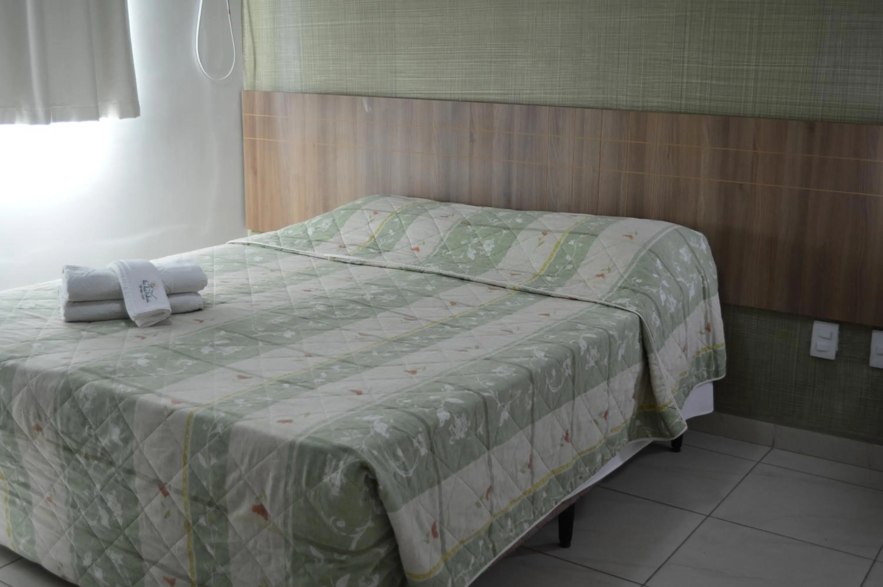 Bed in Rio das Pedras Thermas Hotel